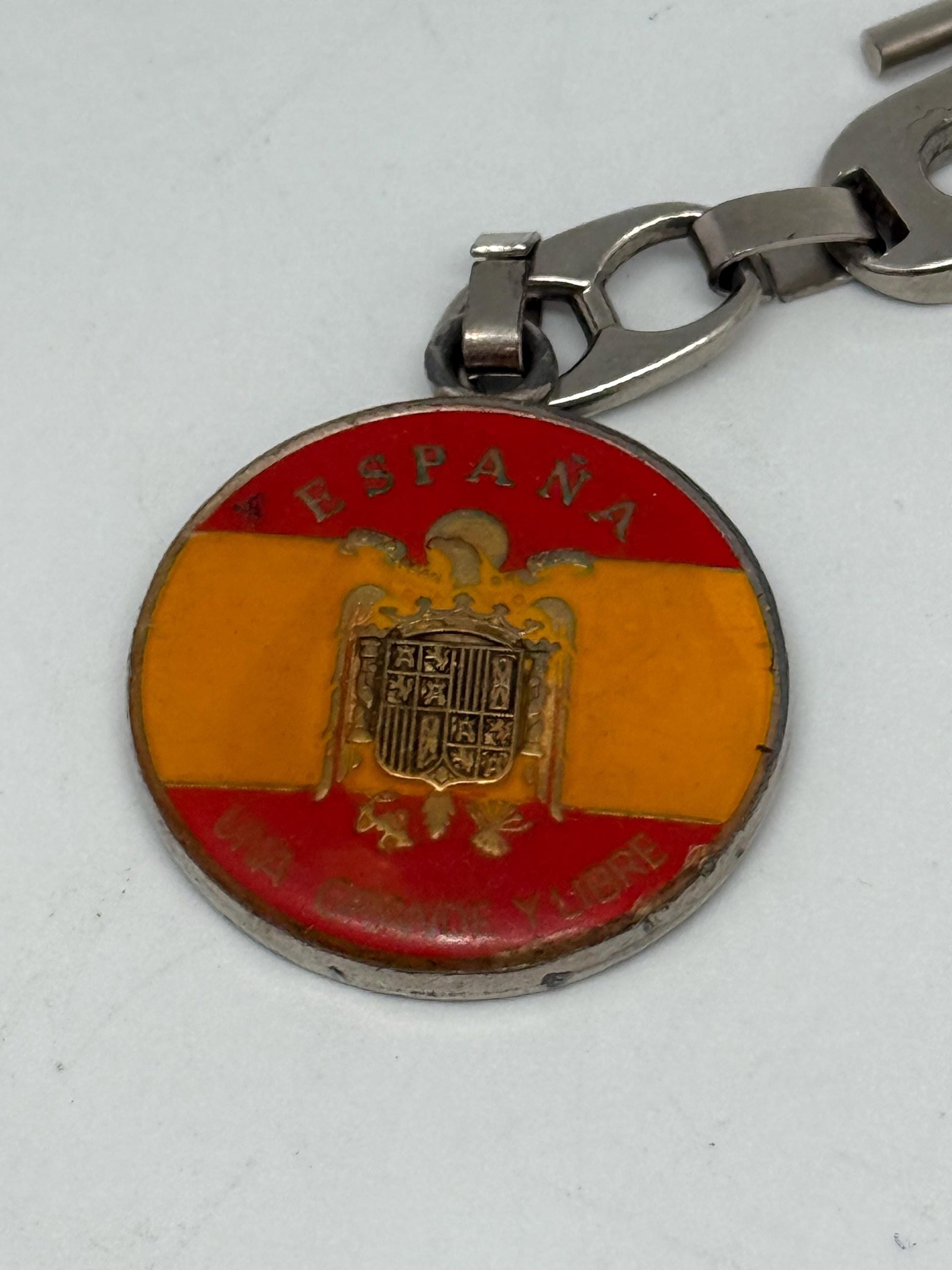 Vintage Spanish Coat of Arms Keychain, silver polished metal, medallion design, patriotic emblem, collectible item, stylish accessory
