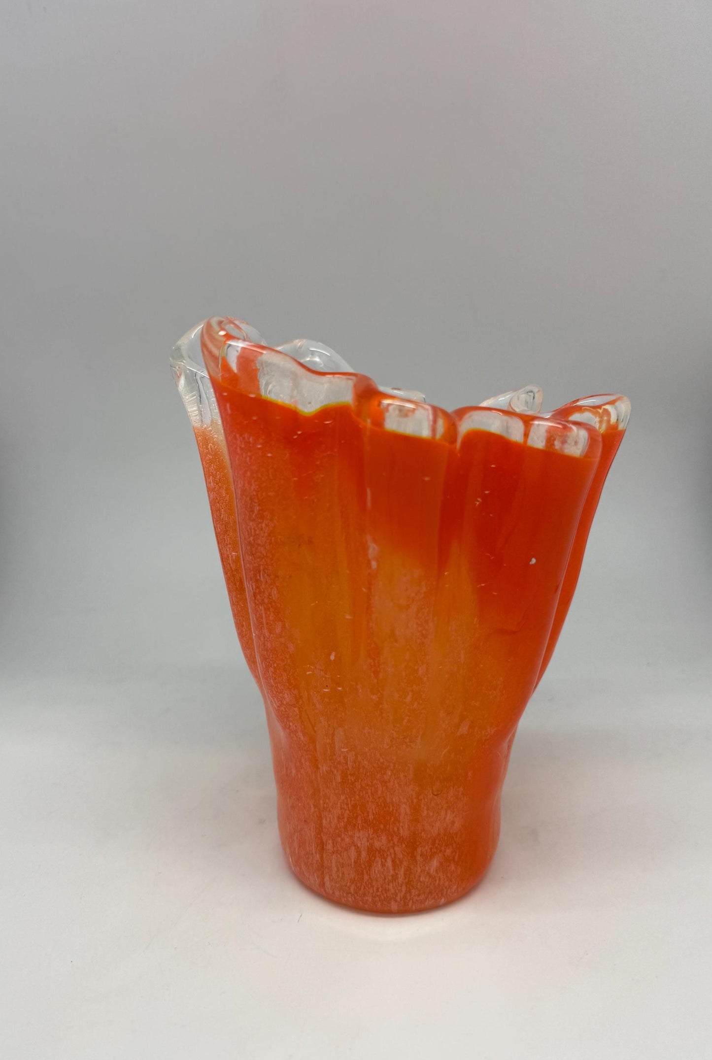 Vintage orange wavy glass vase, hand, blown, freeform design, textured frosted surface, vibrant artisanal piece, home decor accent