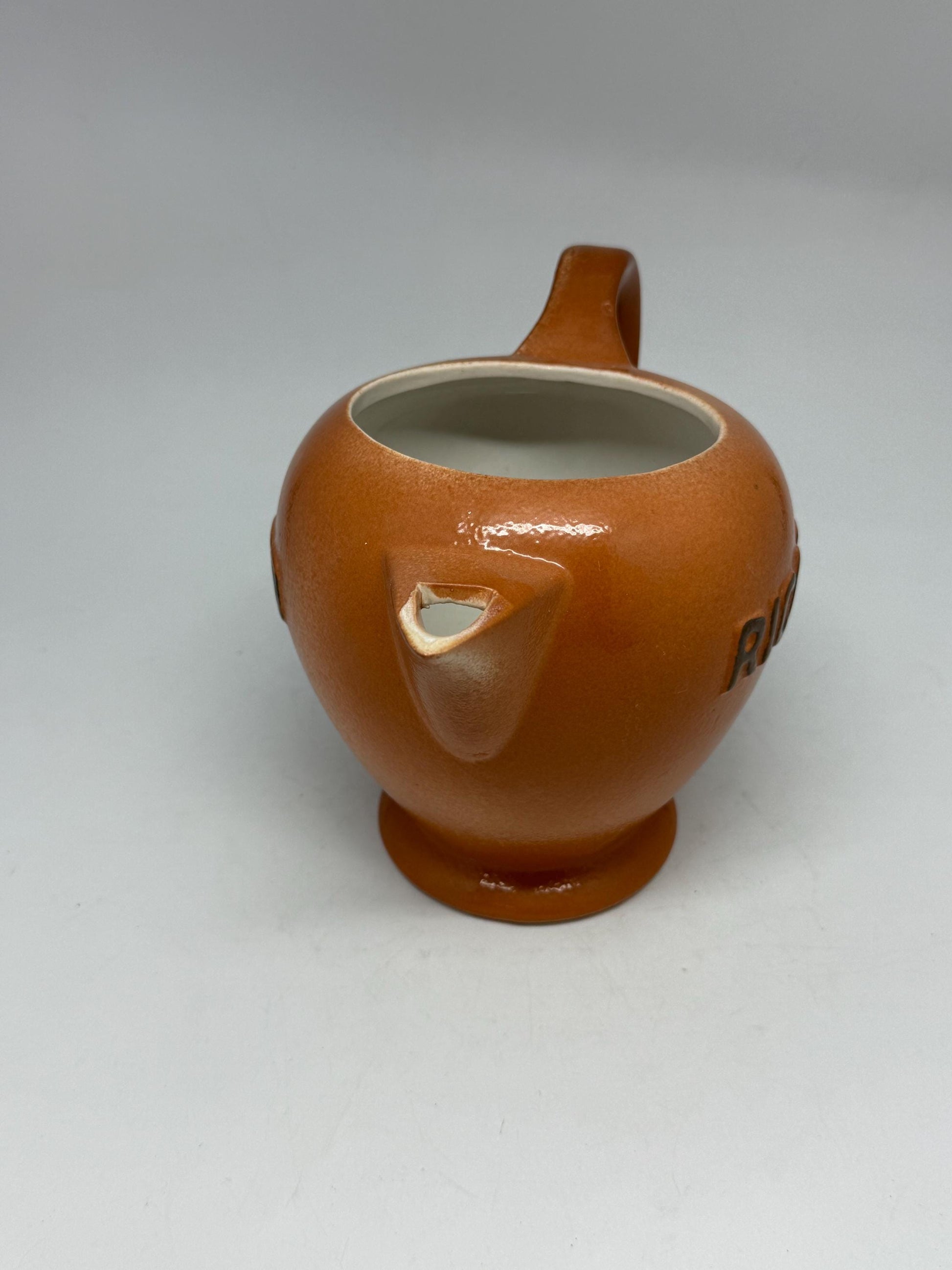 Vintage terracotta Ricard pitcher, ceramic feel, rounded glossy body, iconic branding, retro 80s vibe, tabletop decor