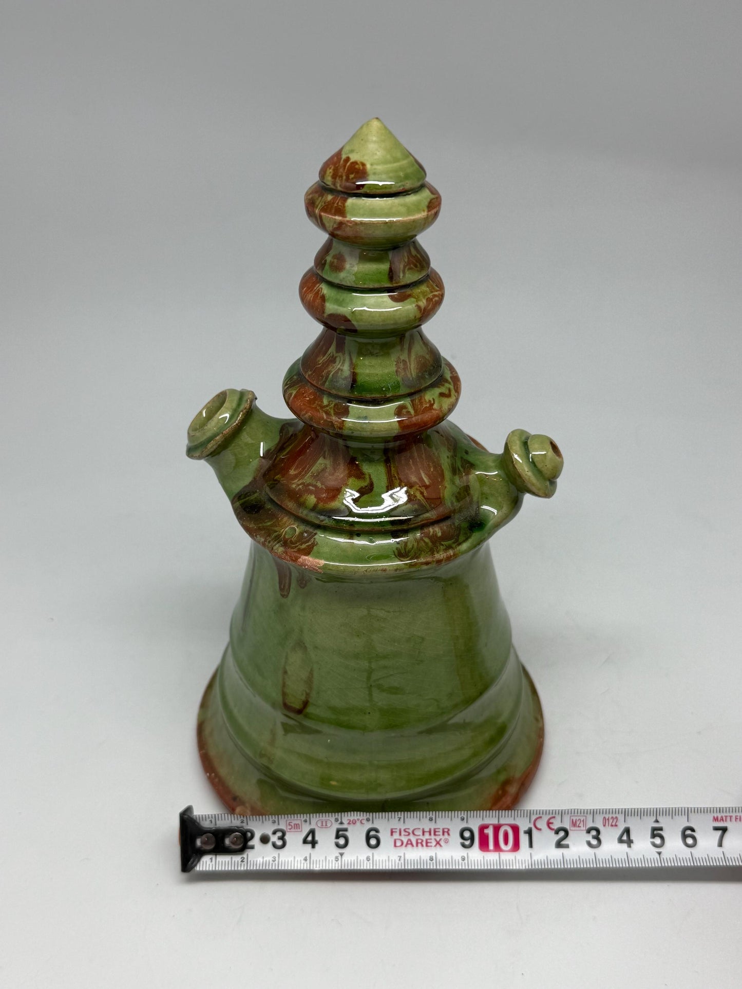 Vintage green tone ceramic pitcher, conical shape, multicolored marble glaze, unique tiered design, retro 70s decor, rustic home accent