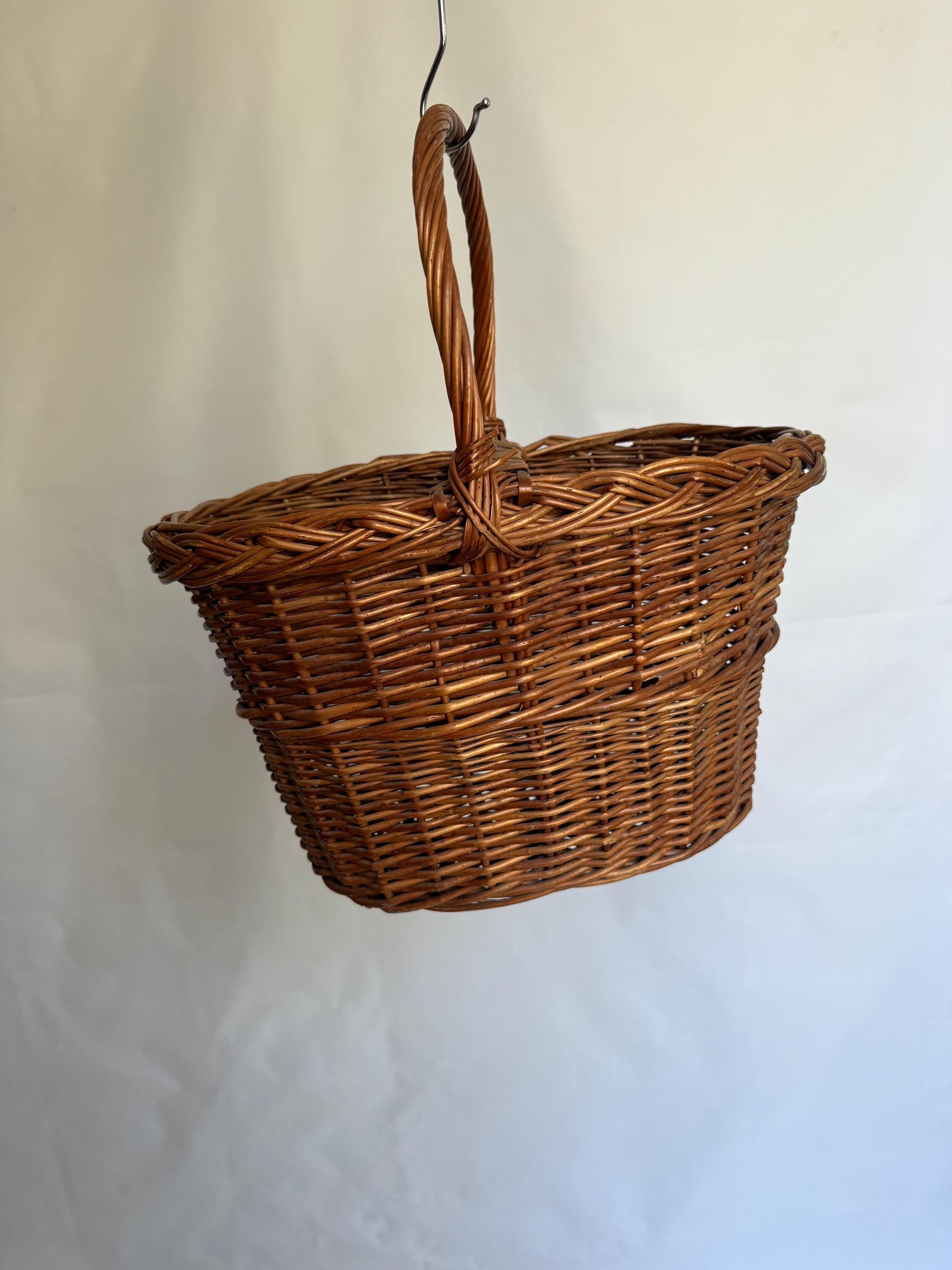 Rustic rattan basket, natural woven design, classic silhouette, autumn basket, crisscross pattern, rustic charm, picnic or storage