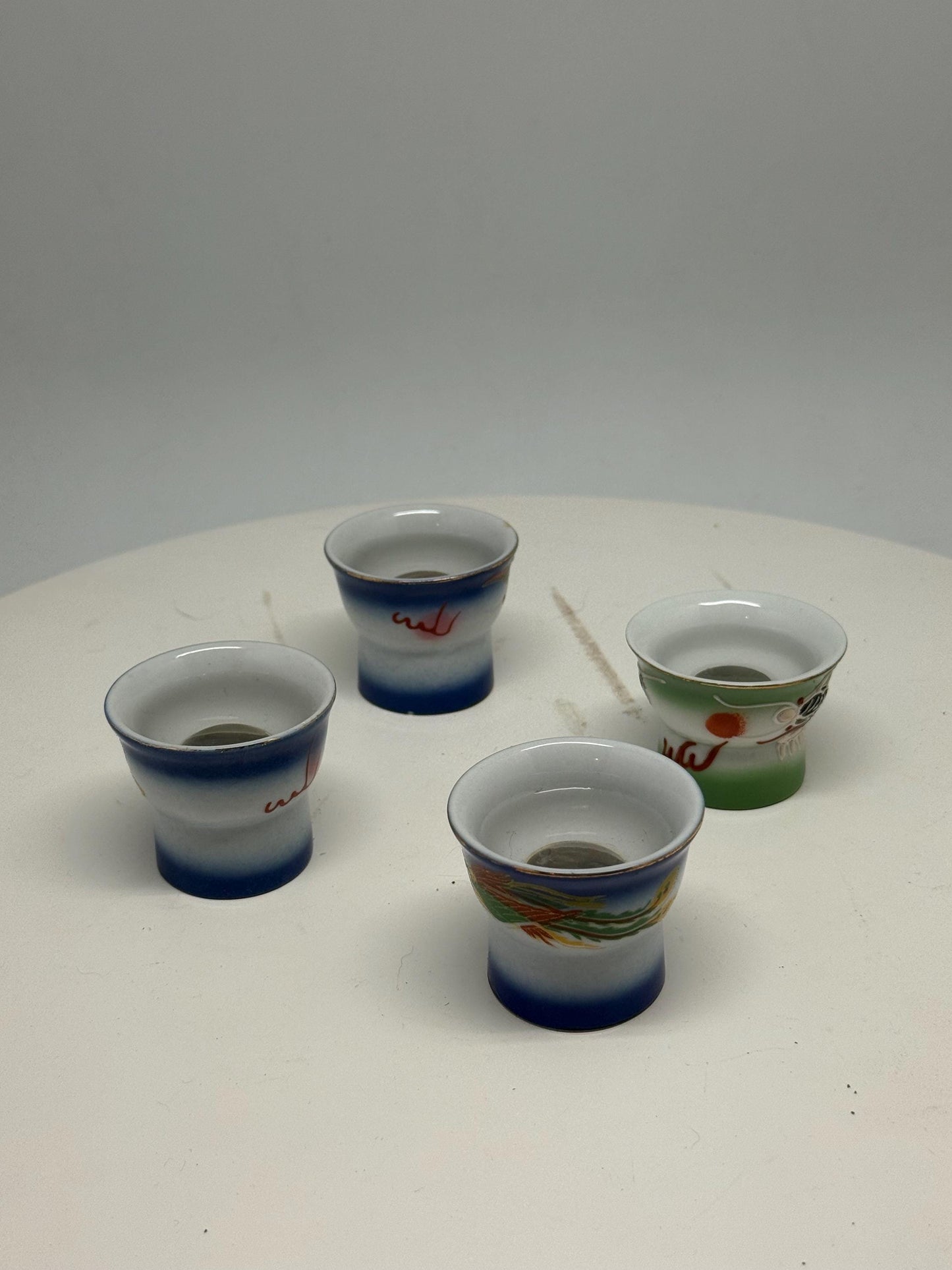 Vintage naughty reveal shot glass set, ceramic, intricate hand painted designs, retro 70s, barware collection