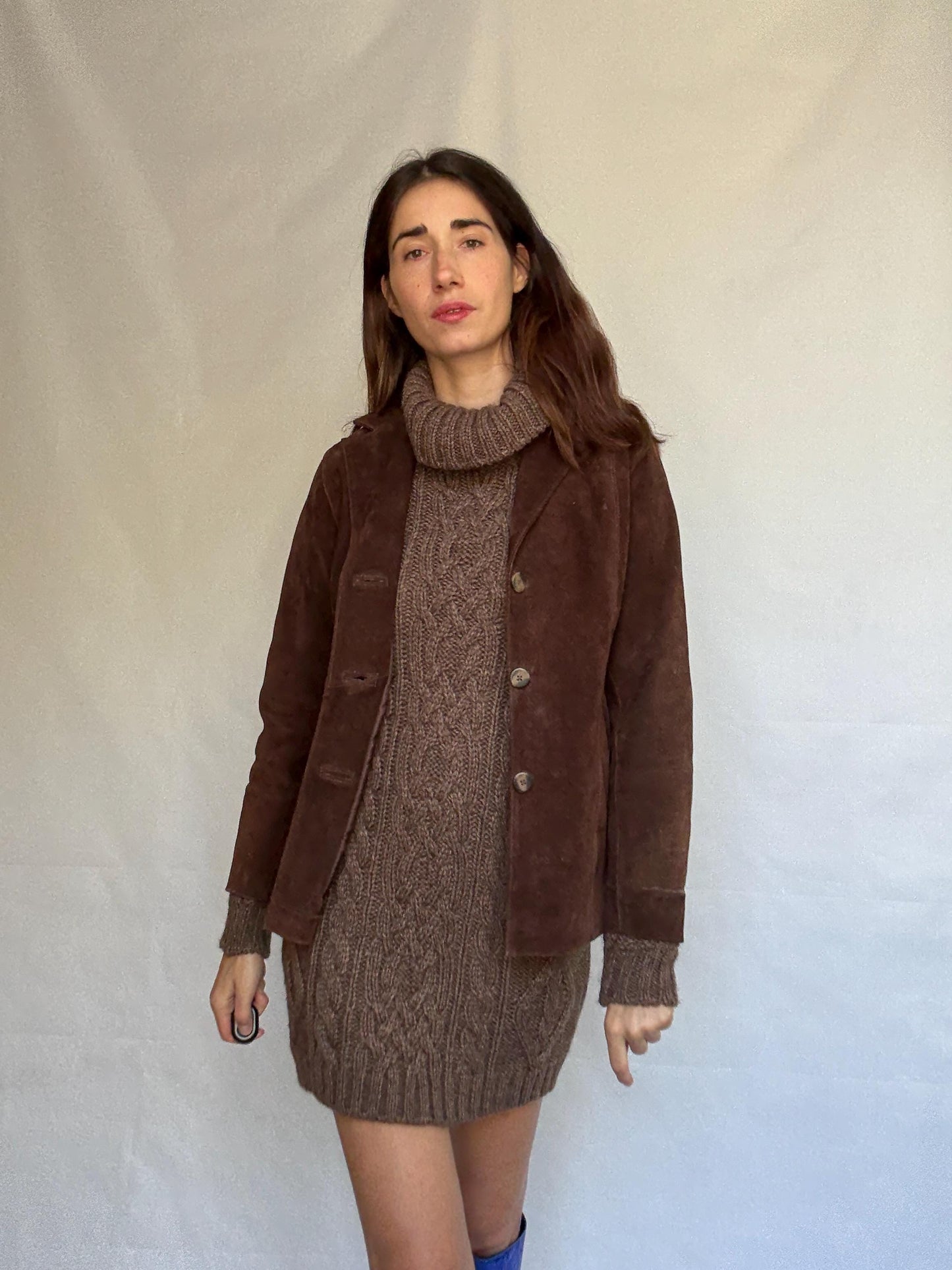 Vintage brown leather jacket, fitted silhouette, button closures, seam detailing, retro 70s vibe, US M, versatile classic style