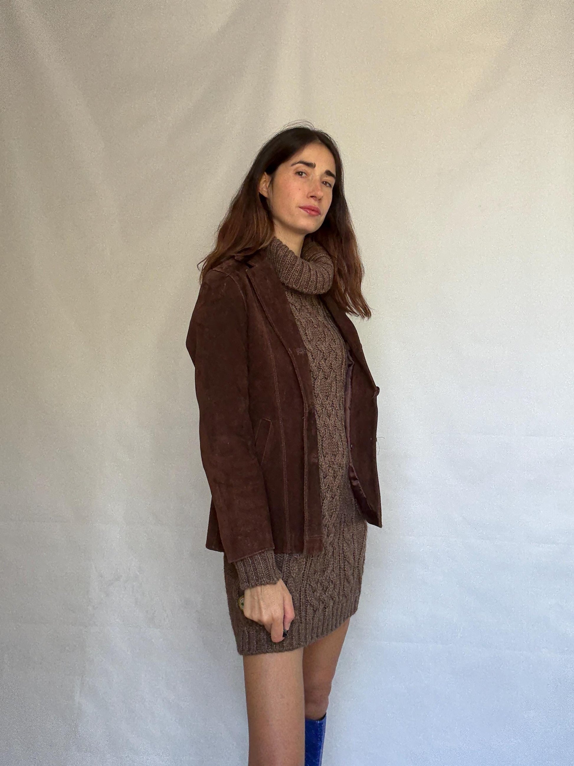 Vintage brown leather jacket, fitted silhouette, button closures, seam detailing, retro 70s vibe, US M, versatile classic style
