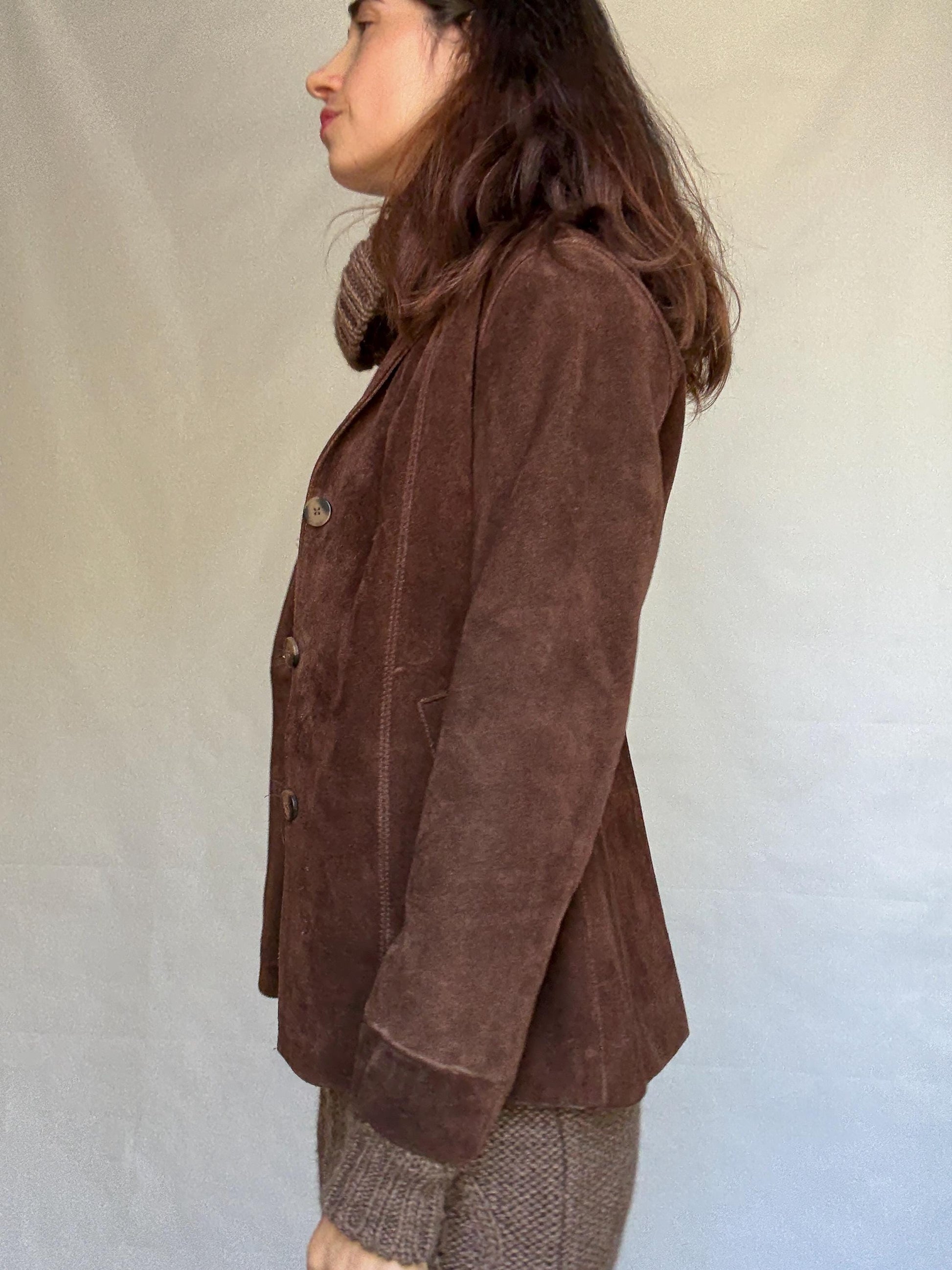 Vintage brown leather jacket, fitted silhouette, button closures, seam detailing, retro 70s vibe, US M, versatile classic style