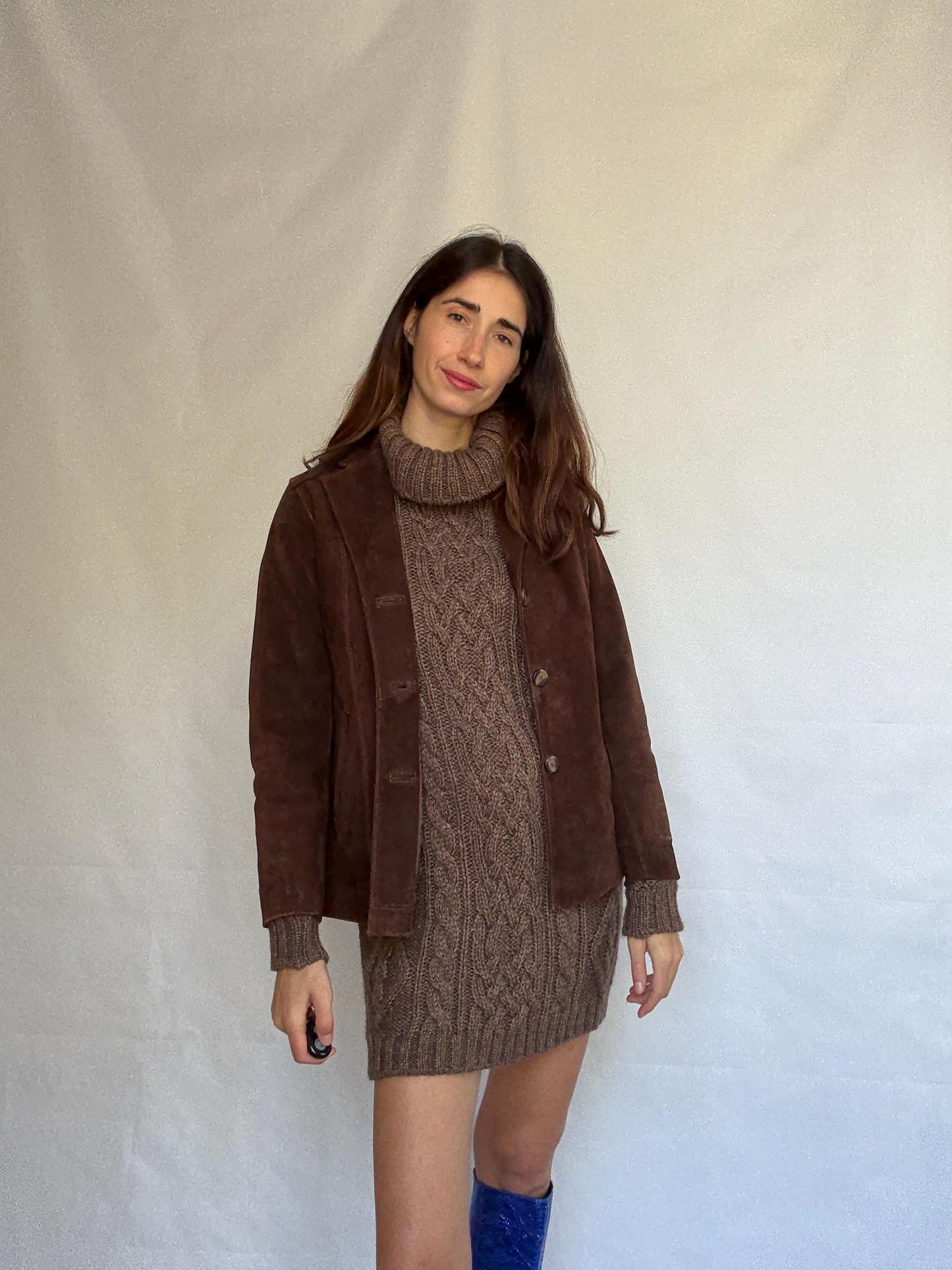 Vintage brown leather jacket, fitted silhouette, button closures, seam detailing, retro 70s vibe, US M, versatile classic style