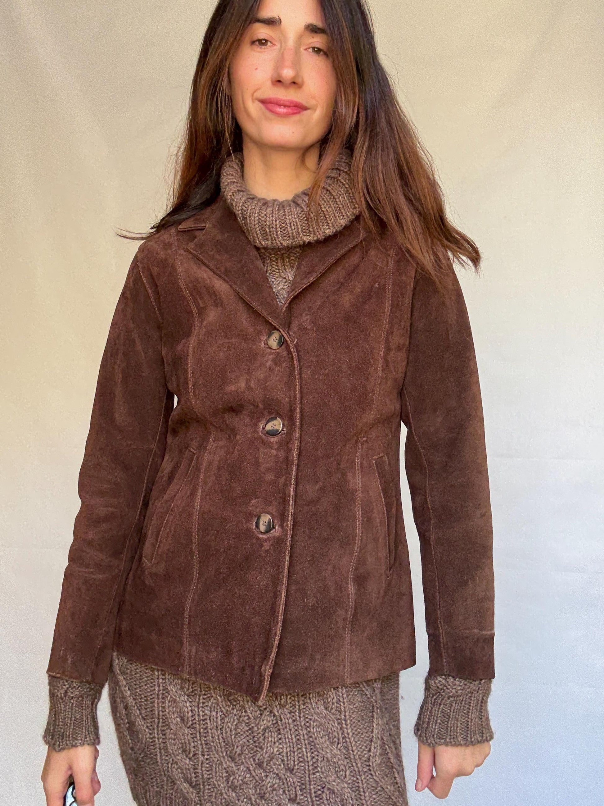 Vintage brown leather jacket, fitted silhouette, button closures, seam detailing, retro 70s vibe, US M, versatile classic style