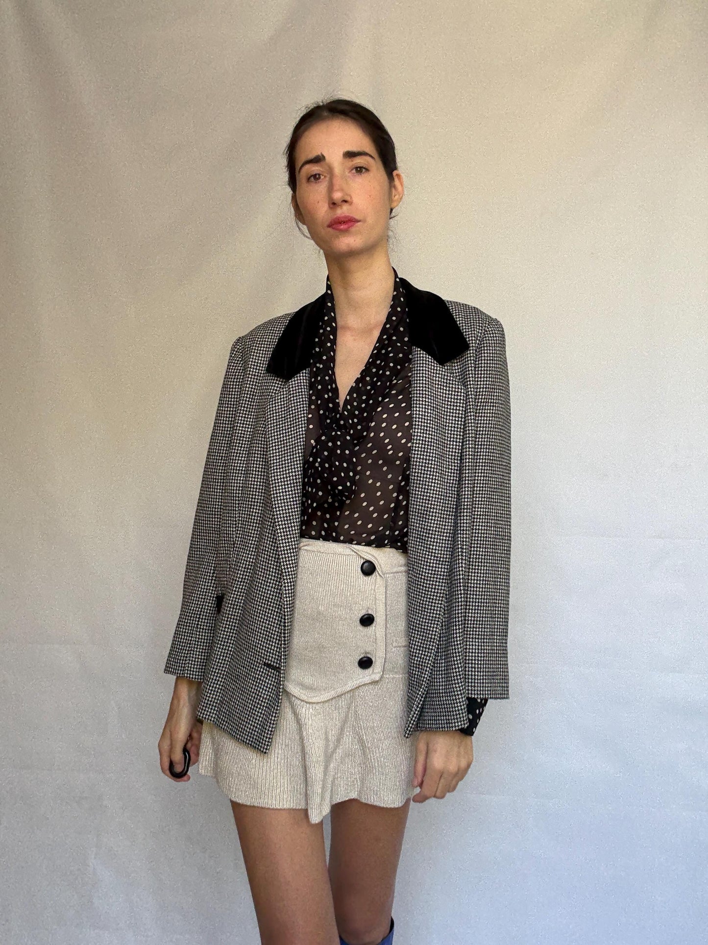 Vintage black and white houndstooth blazer, likely wool, tailored fit, velvet collar, double button cuffs, dark academia, US L