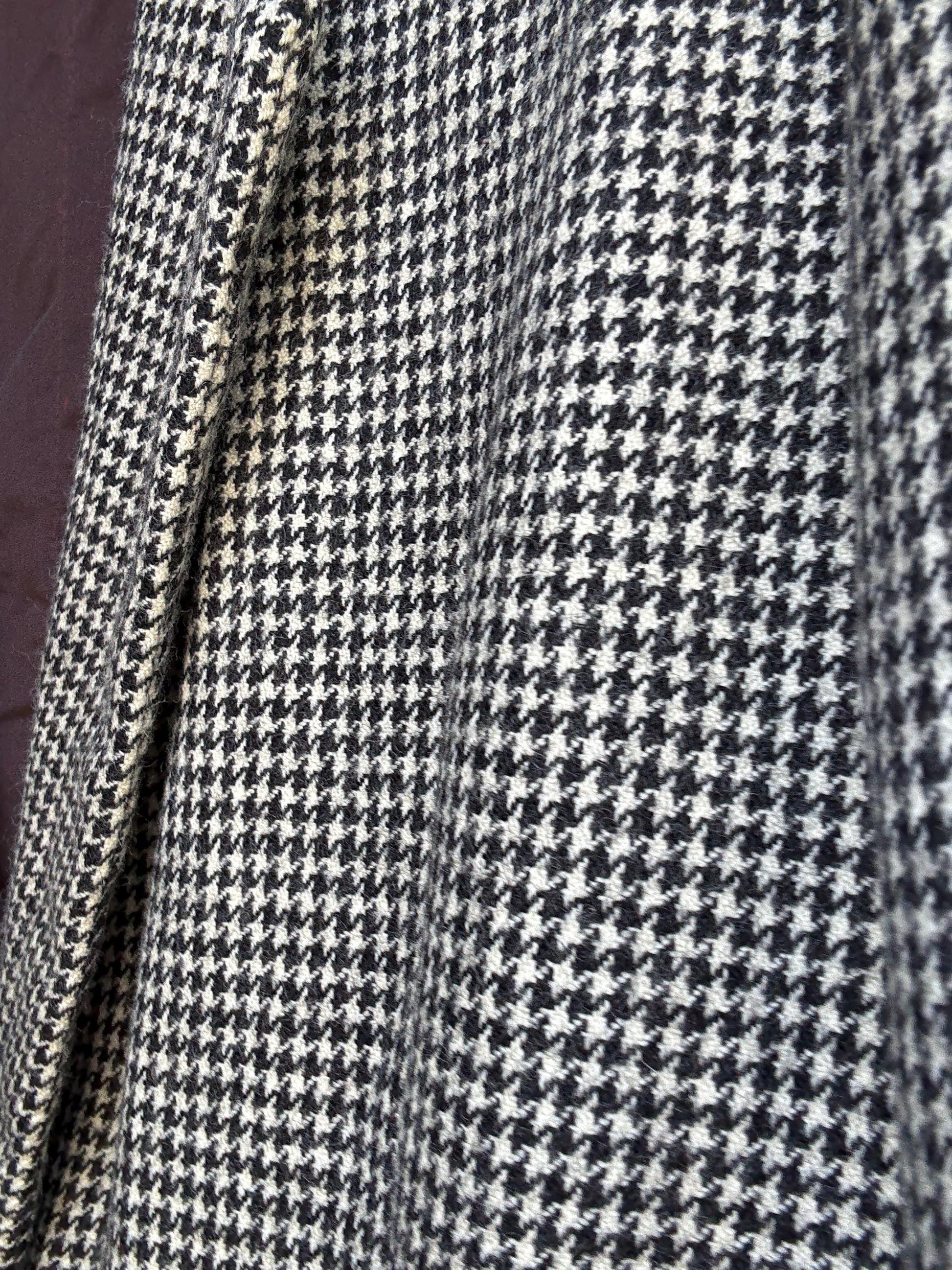 Vintage black and white houndstooth blazer, likely wool, tailored fit, velvet collar, double button cuffs, dark academia, US L