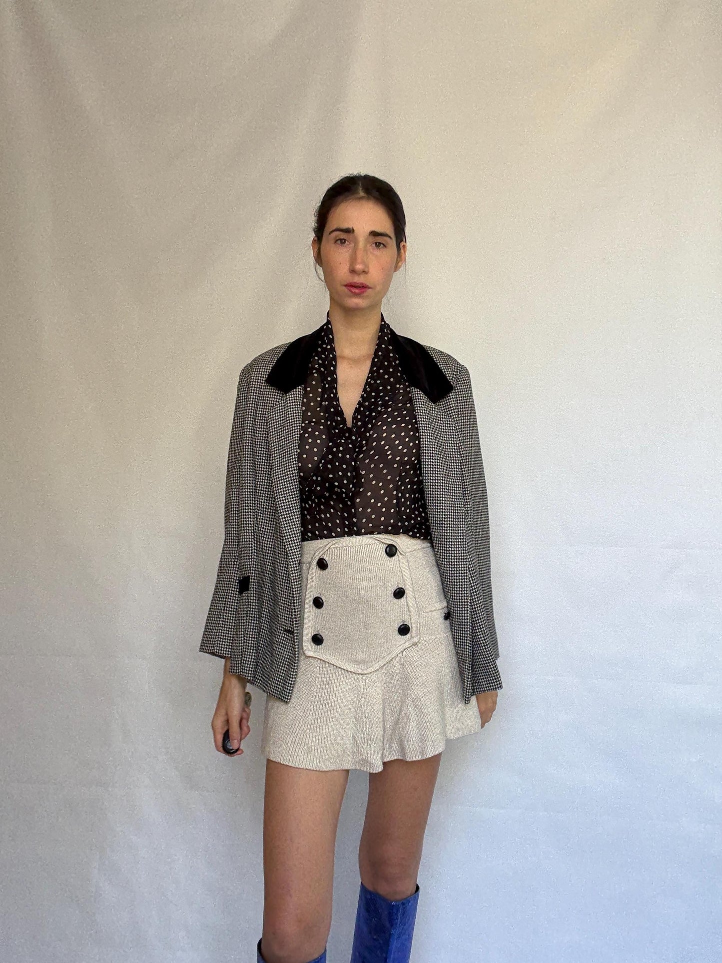 Vintage black and white houndstooth blazer, likely wool, tailored fit, velvet collar, double button cuffs, dark academia, US L