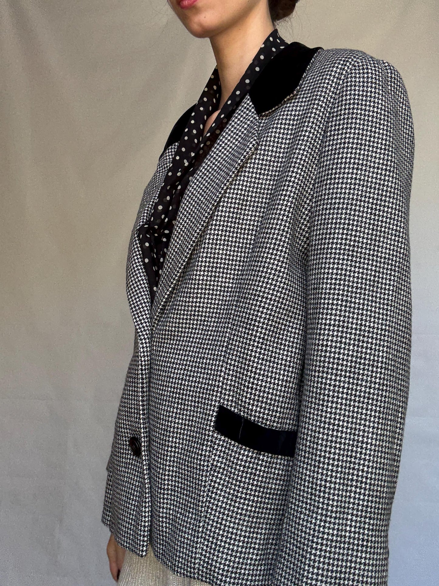 Vintage black and white houndstooth blazer, likely wool, tailored fit, velvet collar, double button cuffs, dark academia, US L