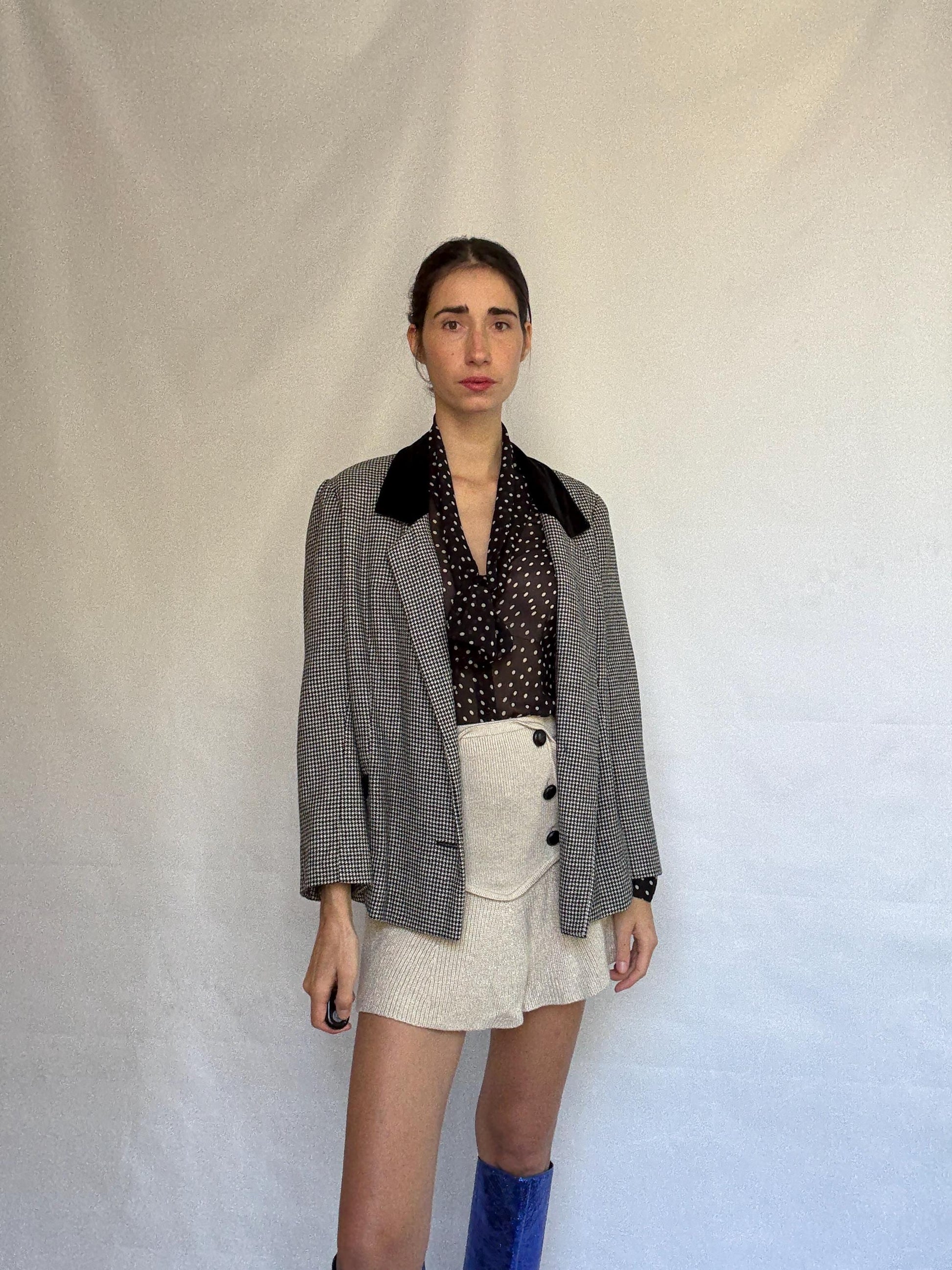 Vintage black and white houndstooth blazer, likely wool, tailored fit, velvet collar, double button cuffs, dark academia, US L