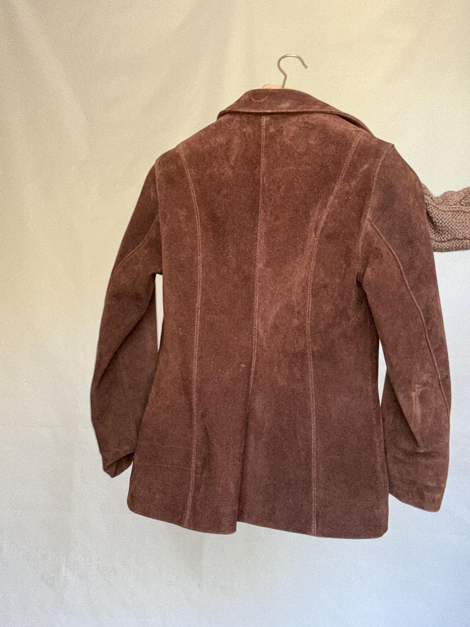 Vintage brown leather jacket, fitted silhouette, button closures, seam detailing, retro 70s vibe, US M, versatile classic style