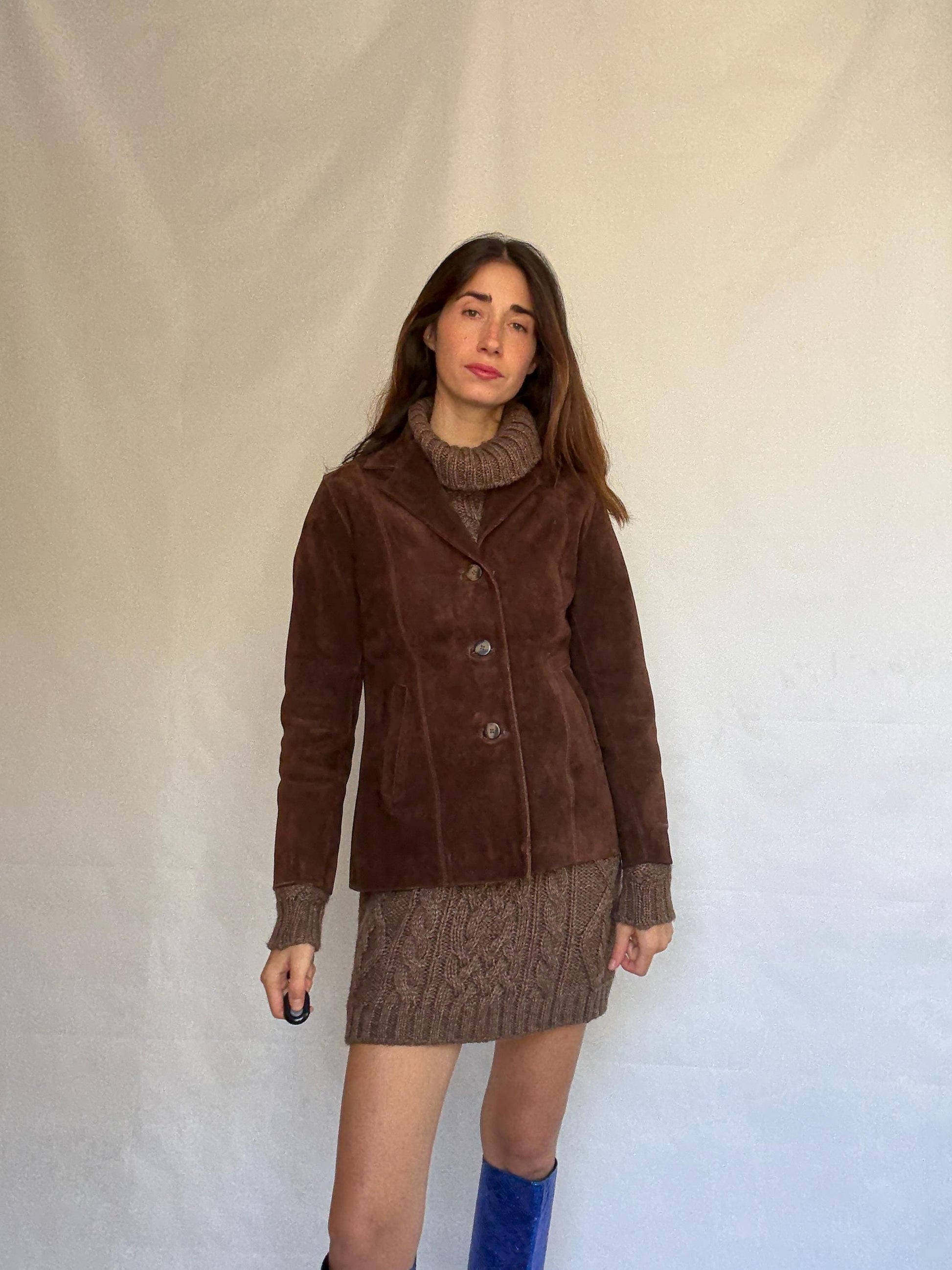 Vintage brown leather jacket, fitted silhouette, button closures, seam detailing, retro 70s vibe, US M, versatile classic style