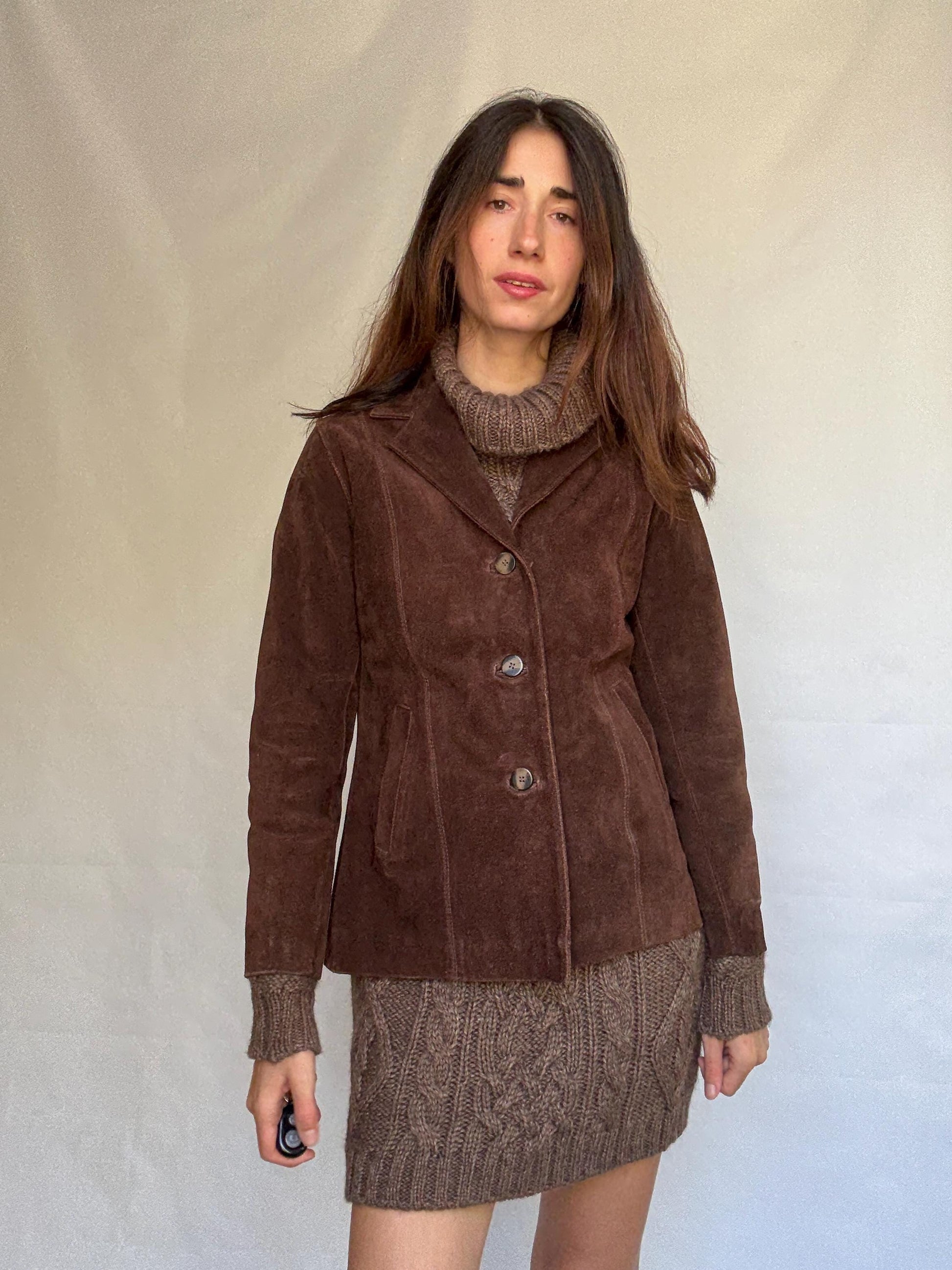 Vintage brown leather jacket, fitted silhouette, button closures, seam detailing, retro 70s vibe, US M, versatile classic style