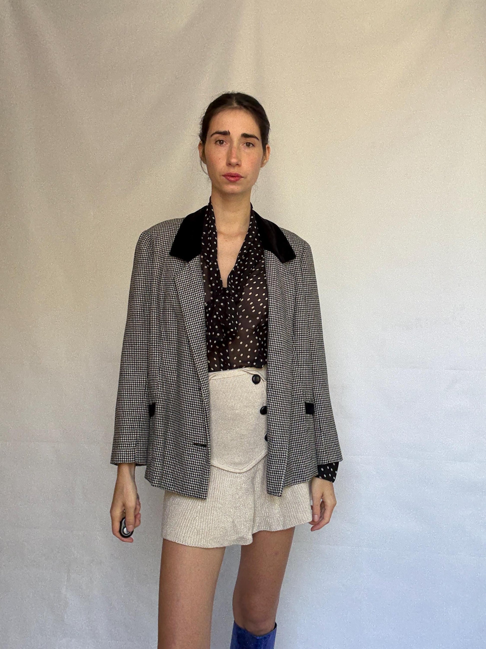 Vintage black and white houndstooth blazer, likely wool, tailored fit, velvet collar, double button cuffs, dark academia, US L