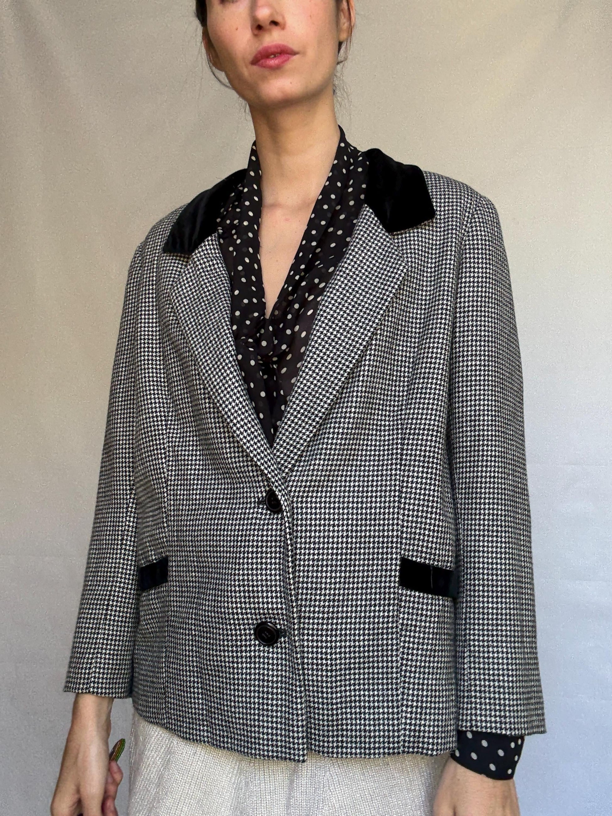 Vintage black and white houndstooth blazer, likely wool, tailored fit, velvet collar, double button cuffs, dark academia, US L