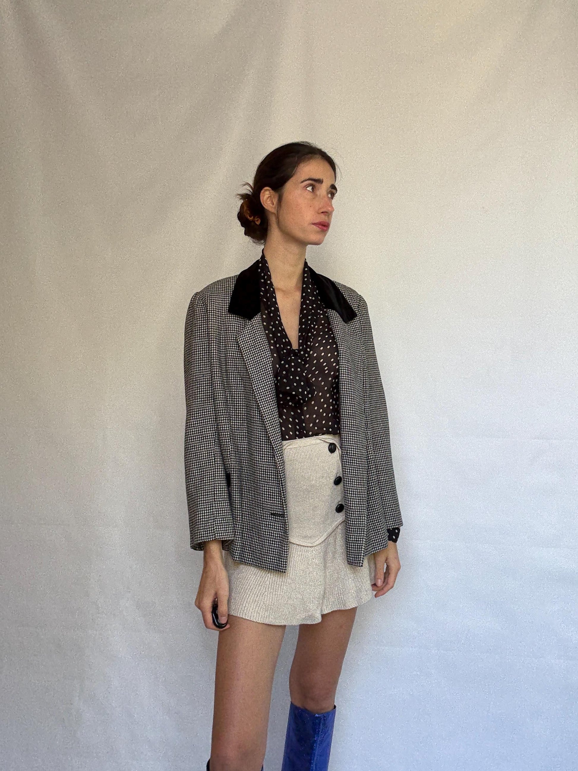 Vintage black and white houndstooth blazer, likely wool, tailored fit, velvet collar, double button cuffs, dark academia, US L