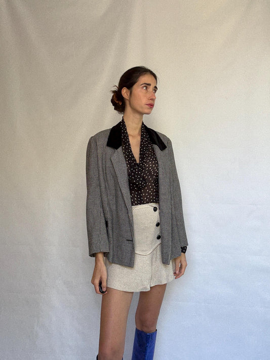 Vintage black and white houndstooth blazer, likely wool, tailored fit, velvet collar, double button cuffs, dark academia, US L