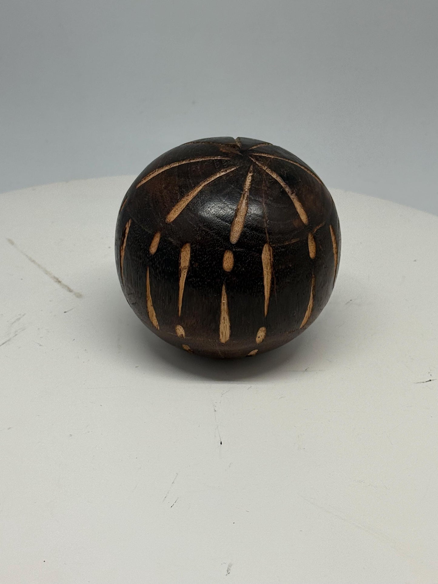 Vintage 70s Hand-Carved Wooden Ball — fabric close-up