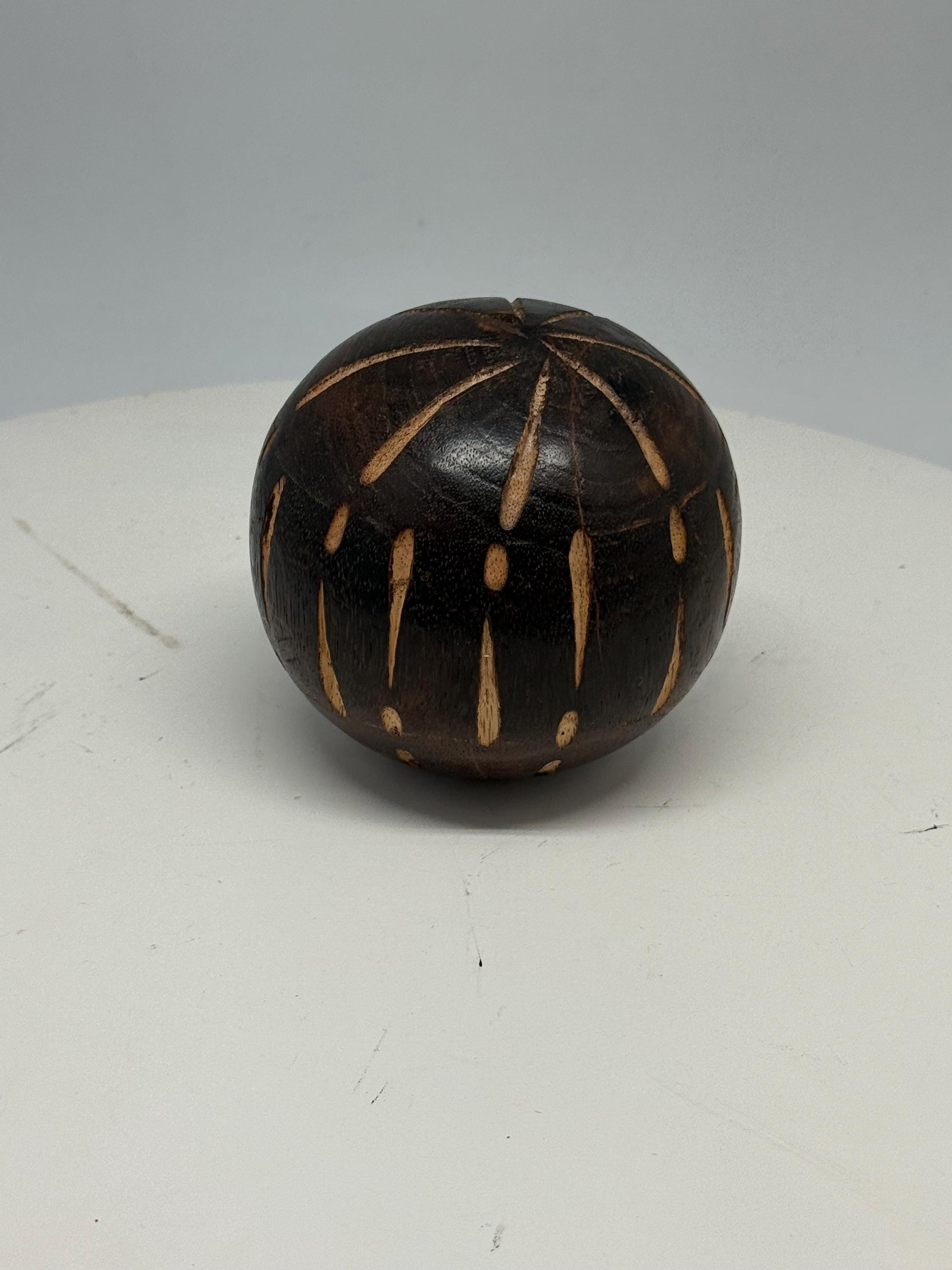 Vintage 70s Hand-Carved Wooden Ball — fabric close-up