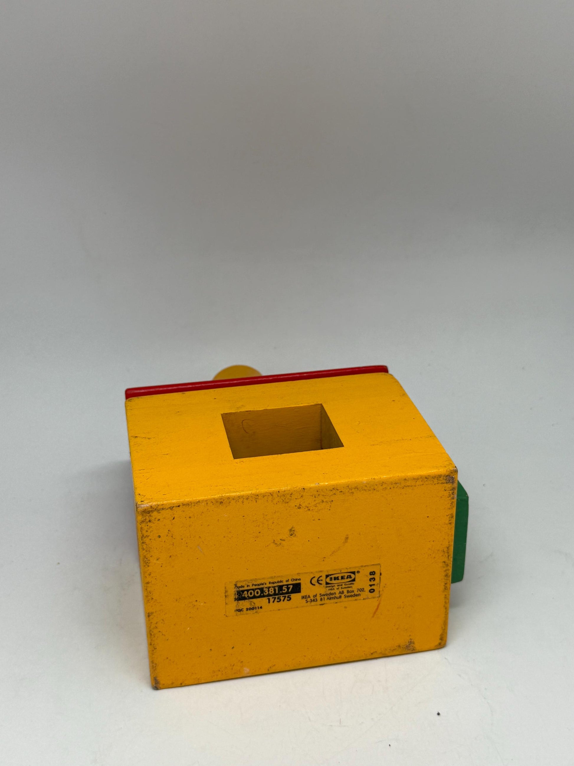 Vintage Wood House Puzzle: Yellow Base, Red Roof — fabric close-up