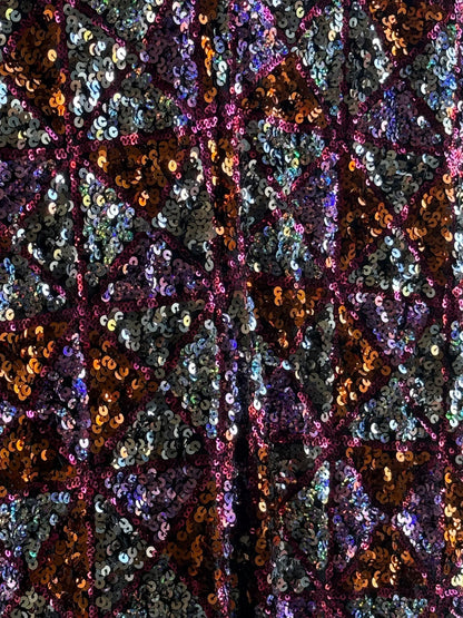 Sequin Flared Pants In Pink And Red — fabric close-up
