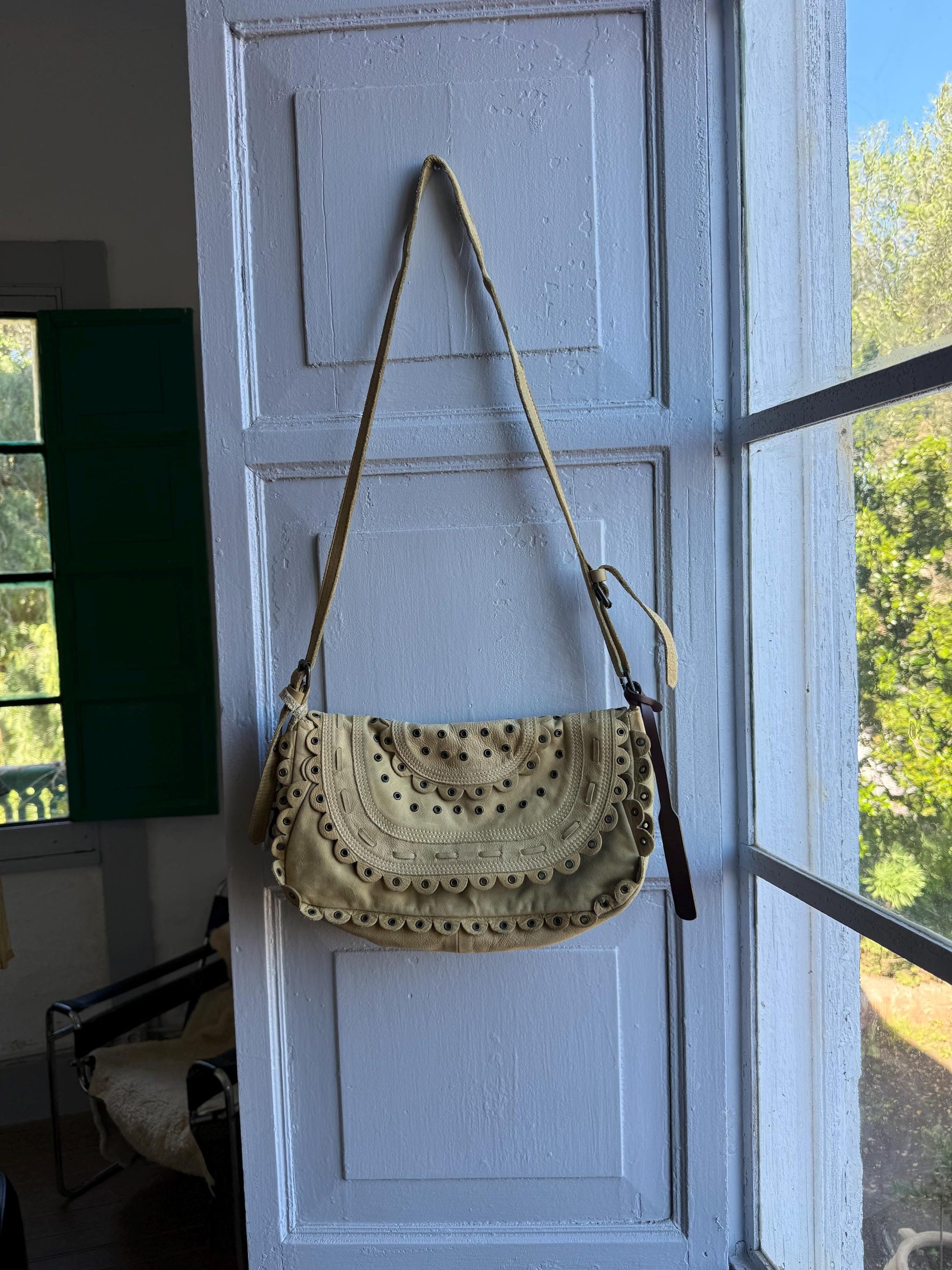 Beige Scalloped Leather Shoulder Bag — fabric close-up