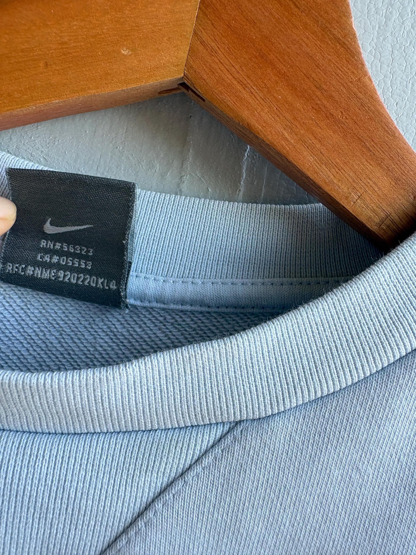 Vintage Light Blue Nike Kids Jumper — fabric close-up
