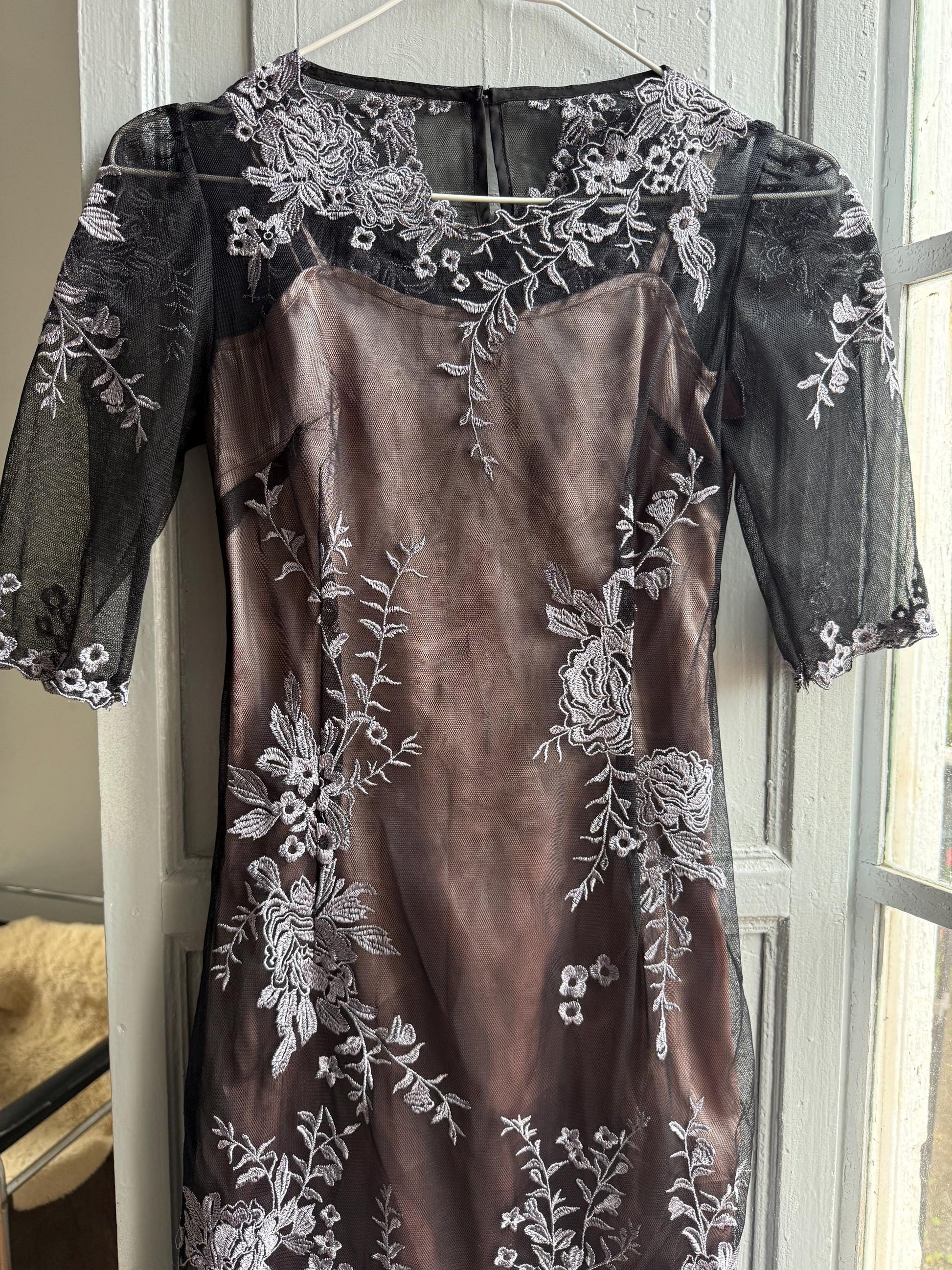 Black Lace Dress With Sheer Overlay — back view