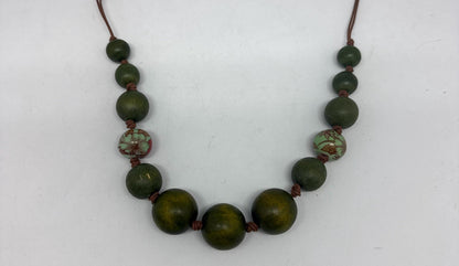 Vintage Green Wooden Beaded Necklace — fabric close-up