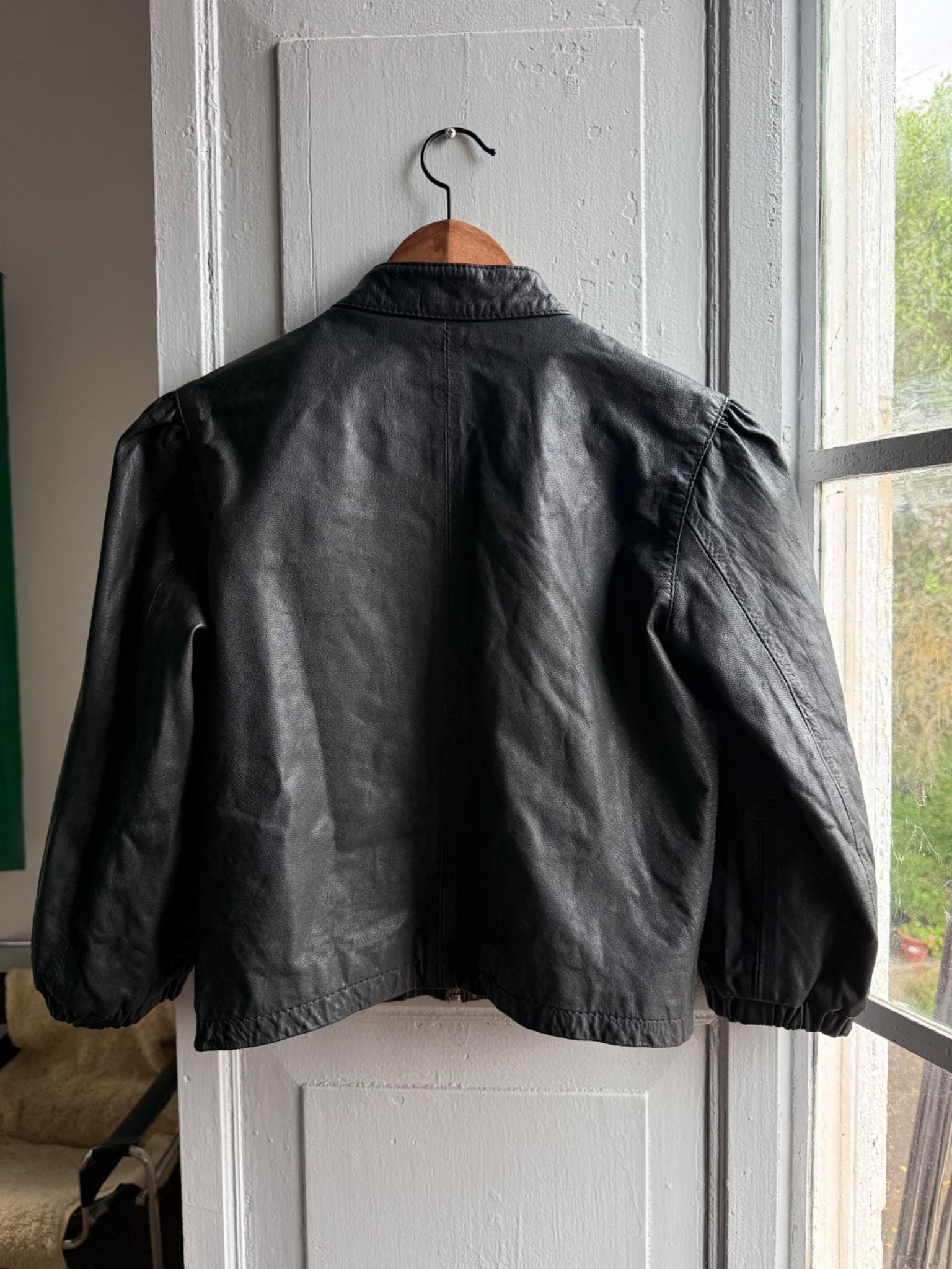 Cropped Black Leather Jacket — back view