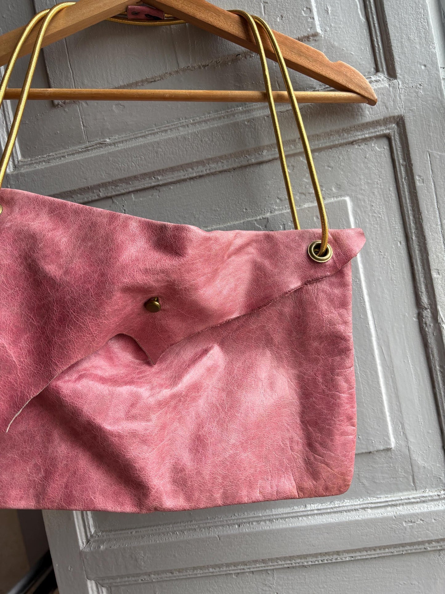 Vintage Pink Slouchy Handbag with Gold Strap — fabric close-up