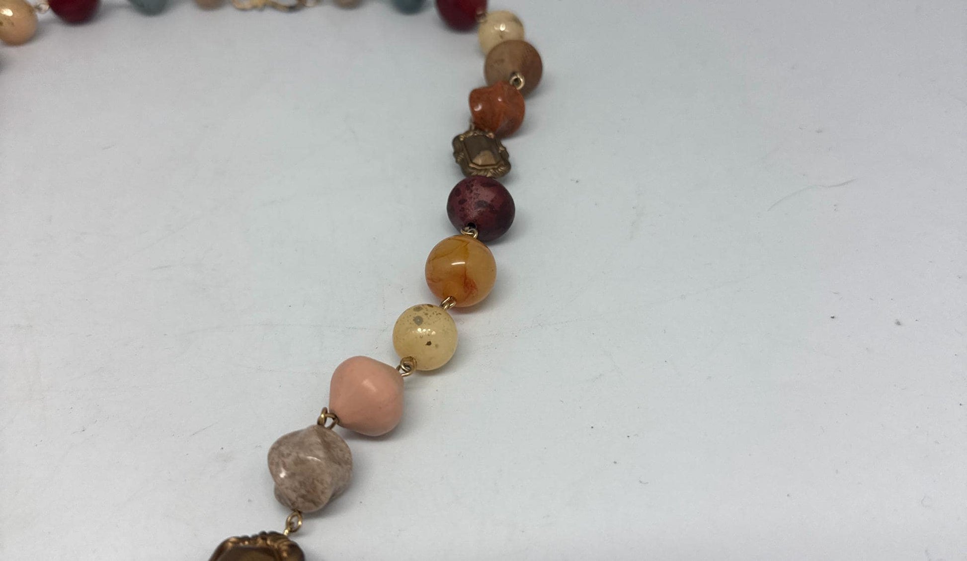Vintage Multicolor Stone Mediterranean Necklace — fabric close-up