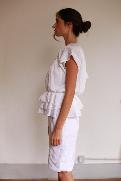 Textured White Knee-Length Peplum Dress — back view