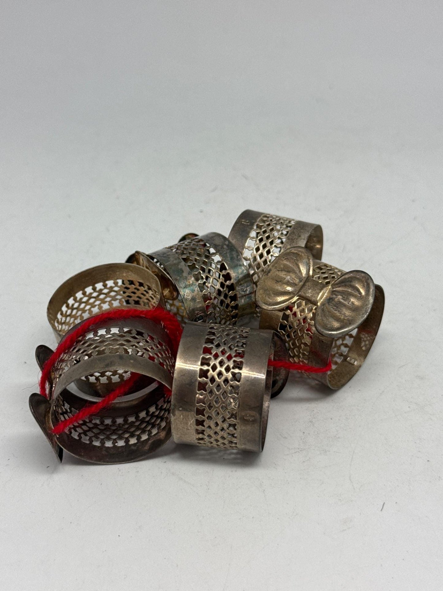 Elegant Vintage Silver Bow Napkin Rings Set — fabric close-up