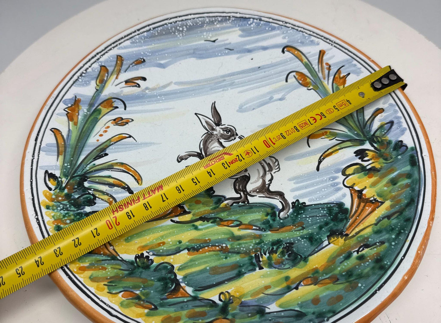 Vintage Handpainted Rabbit Ceramic Plate — fabric close-up
