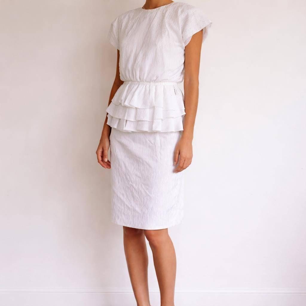 Textured White Knee-Length Peplum Dress