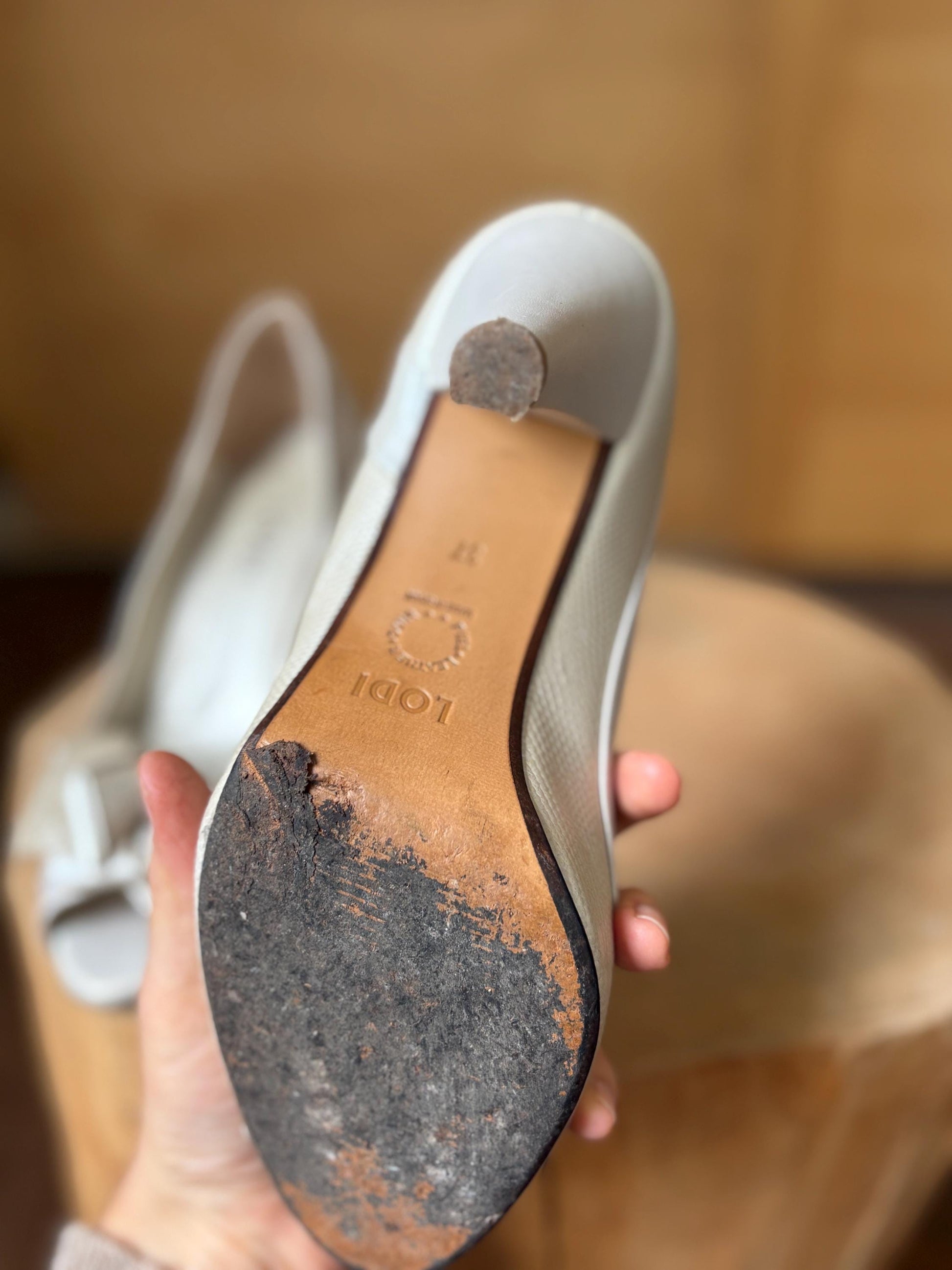 Ivory Leather Peep Toe Heels — fabric close-up