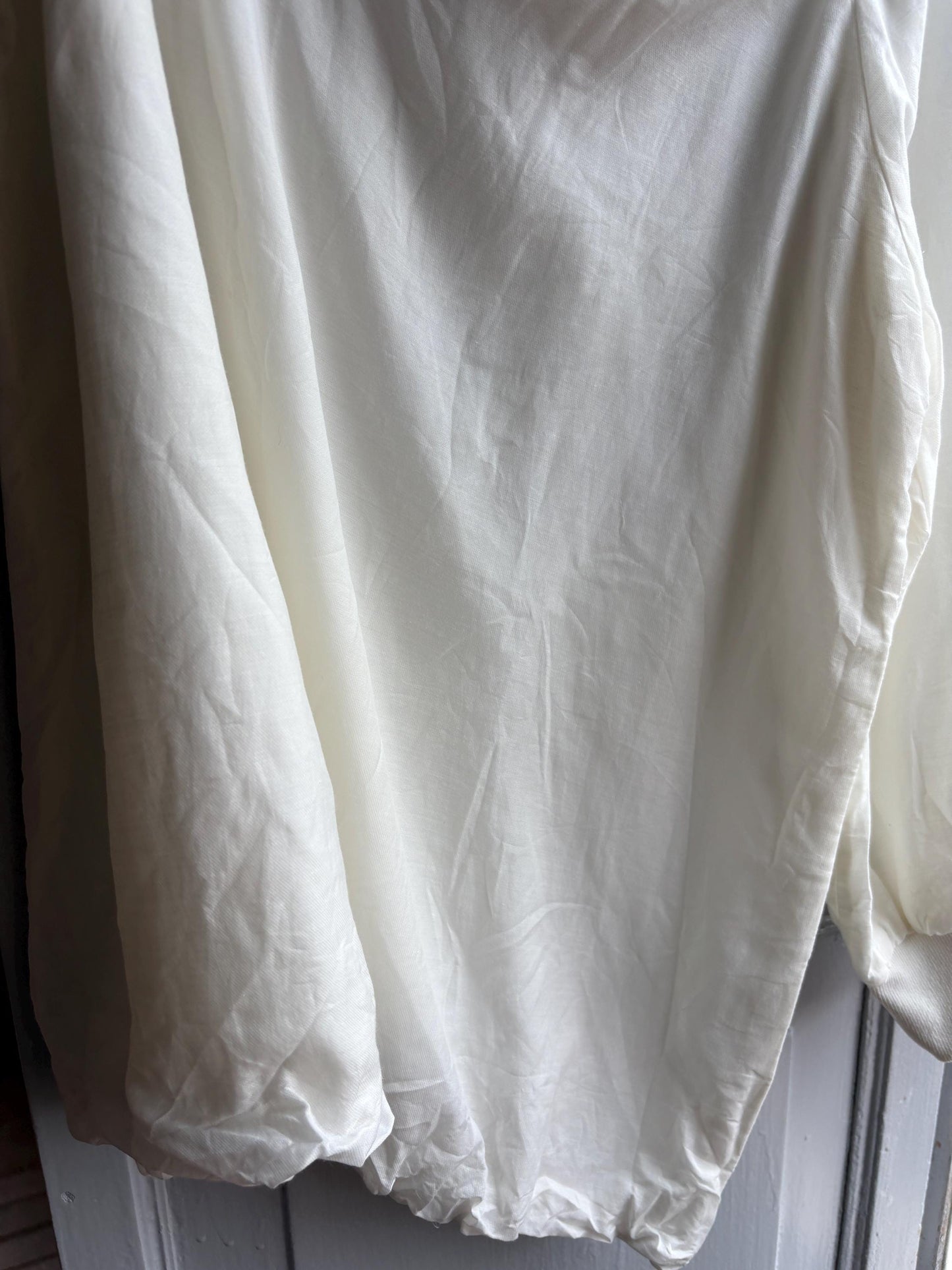 White One Shoulder Asymmetric Top — fabric close-up