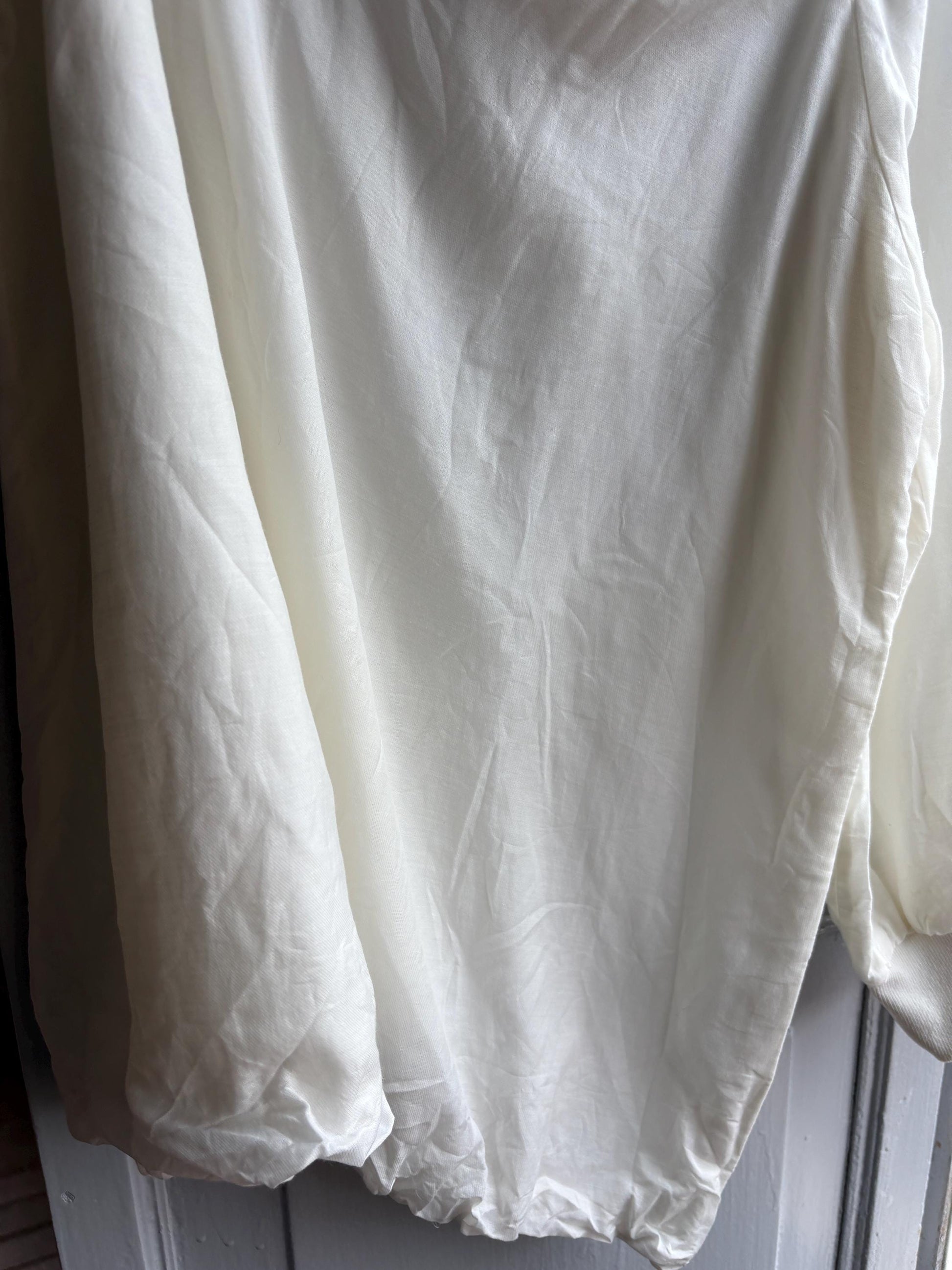 White One Shoulder Asymmetric Top — fabric close-up