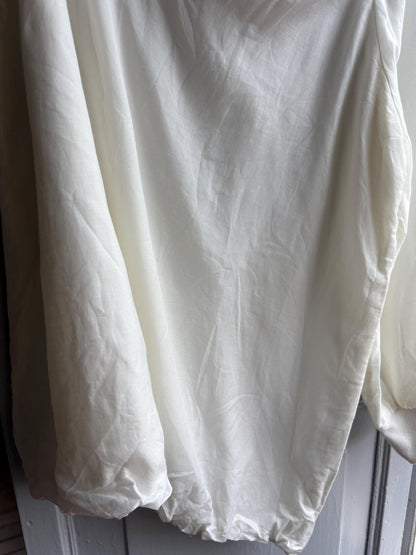 White One Shoulder Asymmetric Top — fabric close-up