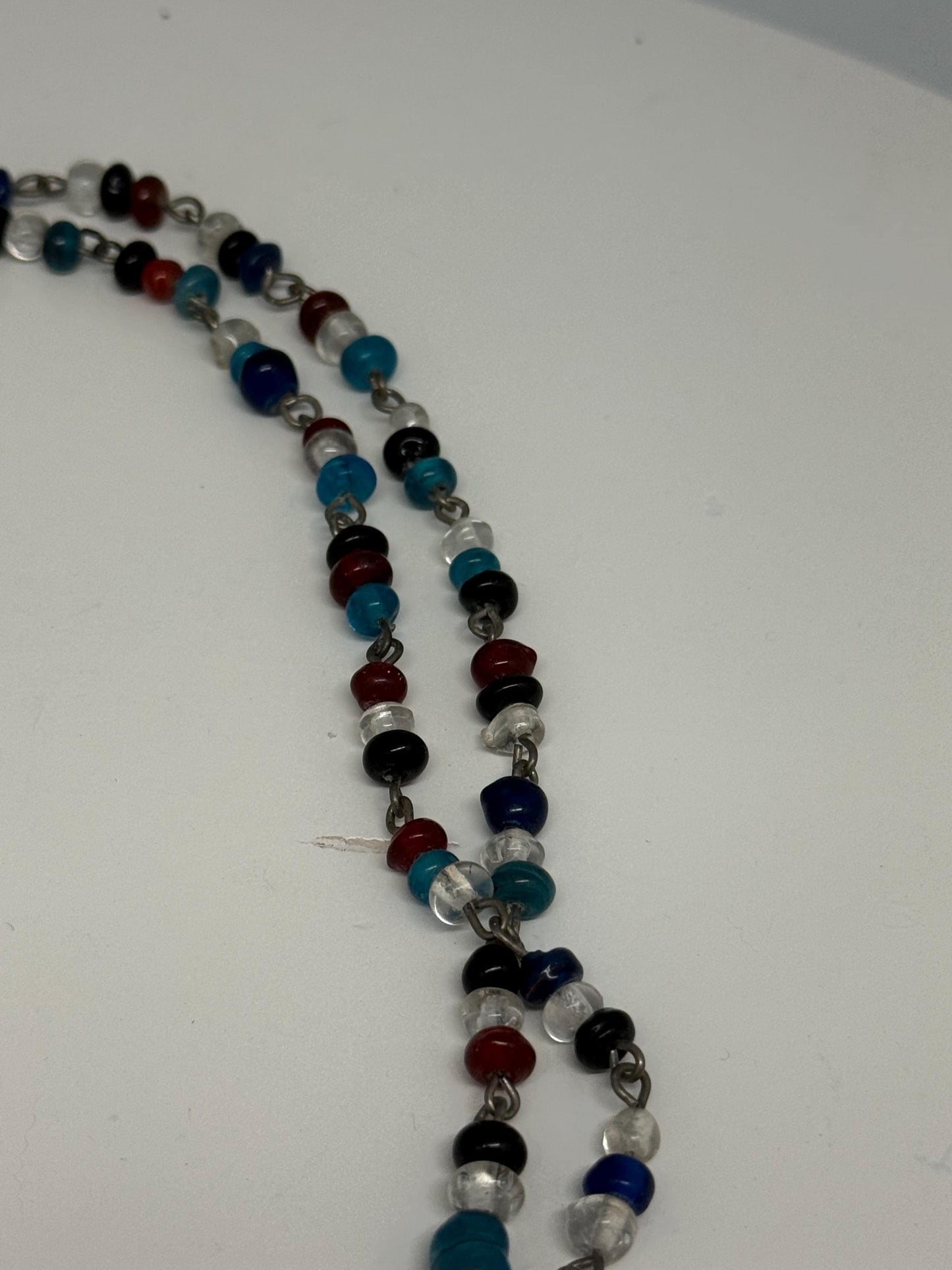 Vintage Double Strand Glass Bead Necklace — fabric close-up