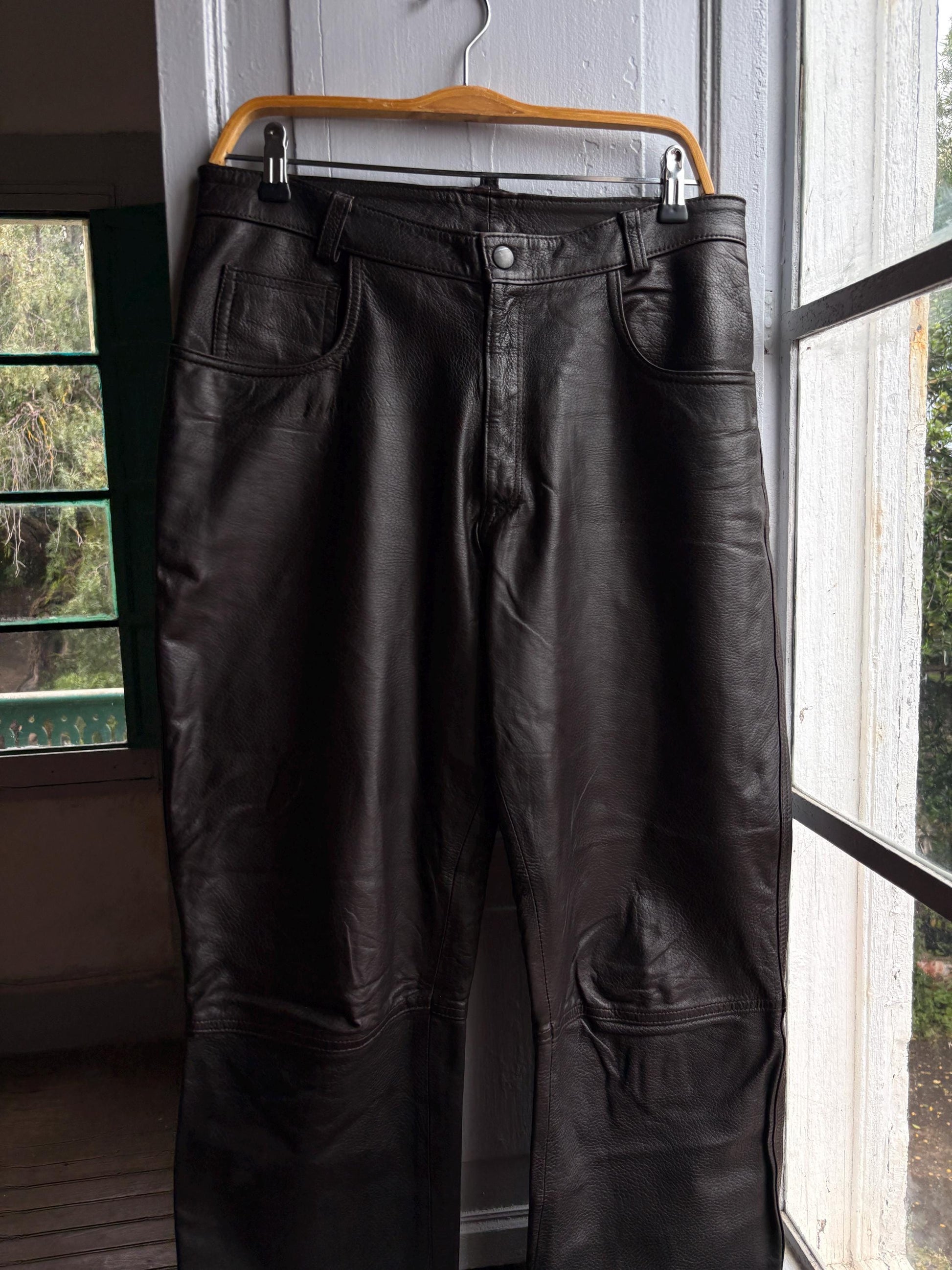 Vintage Black Leather High Waist Trousers — fabric close-up
