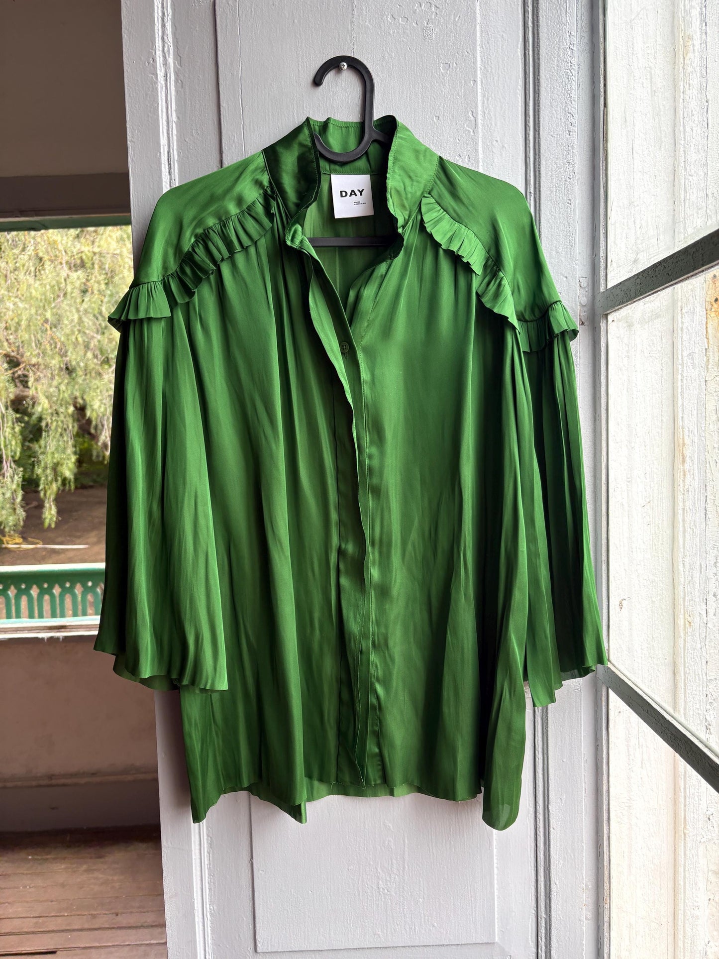 Emerald Satin Ruffle Blouse — fabric close-up