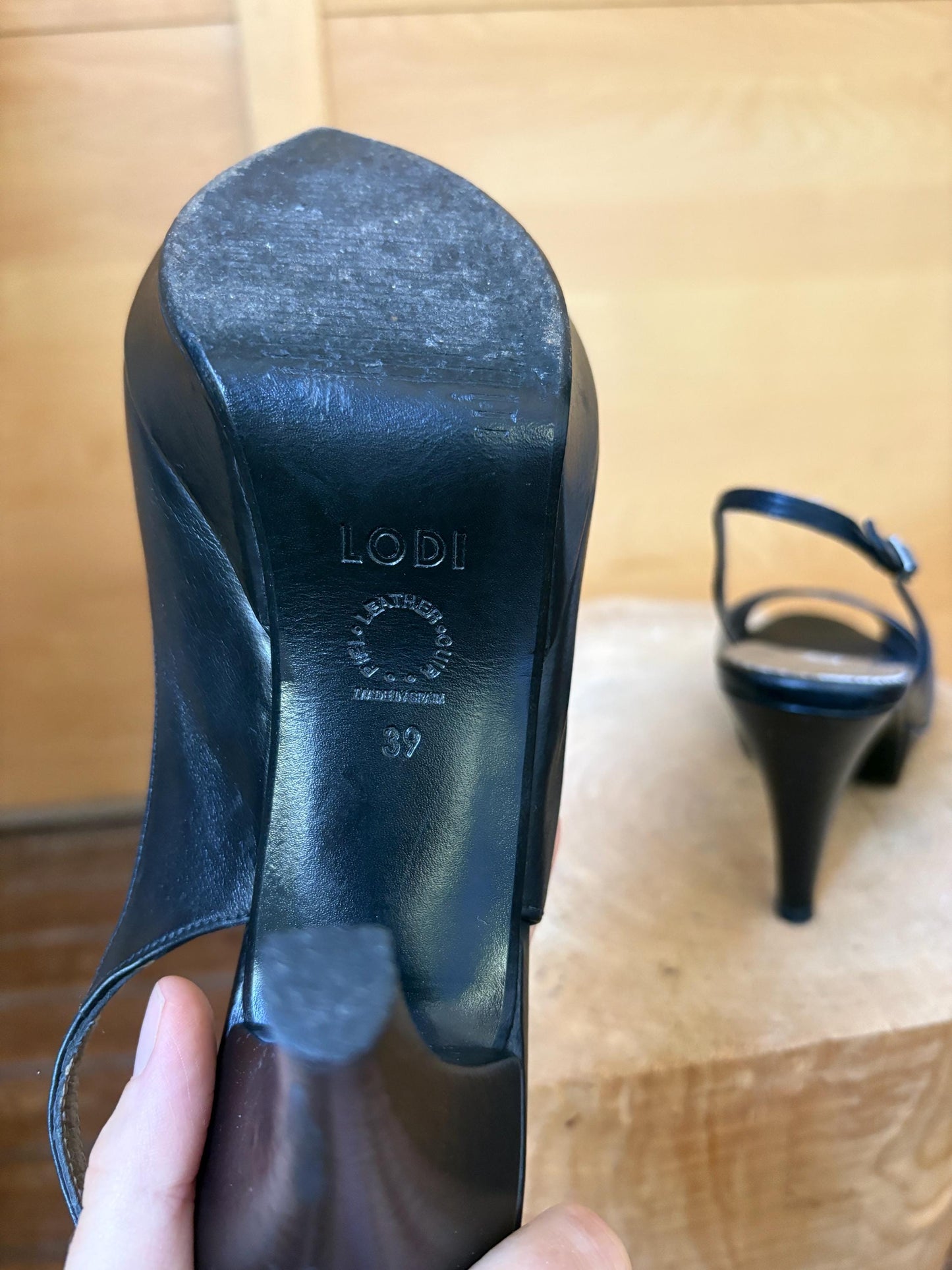 Black Leather Peep Toe Slingback Heels — fabric close-up