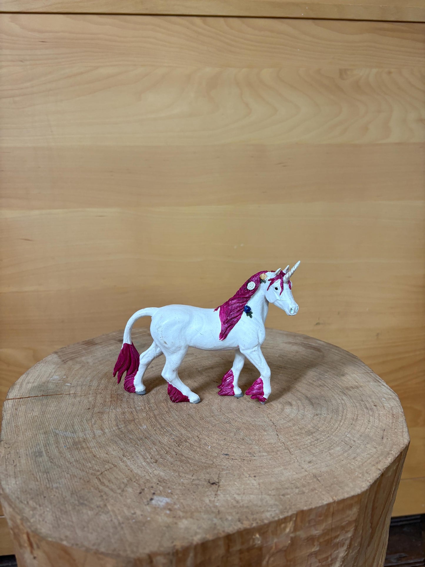 Pink Unicorn Figurine with Floral Details — detail