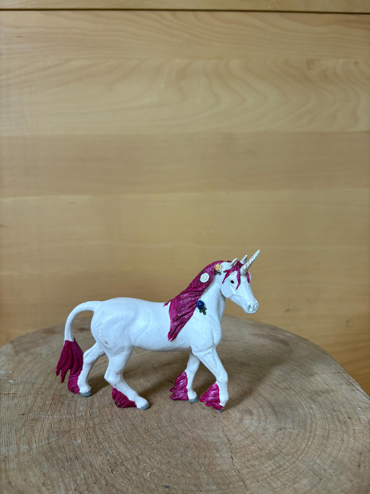 Pink Unicorn Figurine with Floral Details — back view