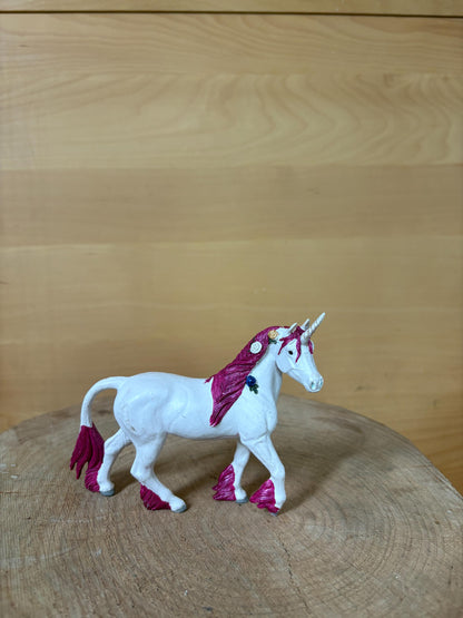 Pink Unicorn Figurine with Floral Details — back view