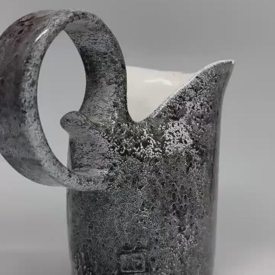 Vintage charcoal speckled ceramic creamer pitcher – sculptural swirl handle – 15cm tall – 10cm top width – rustic kitchen decor